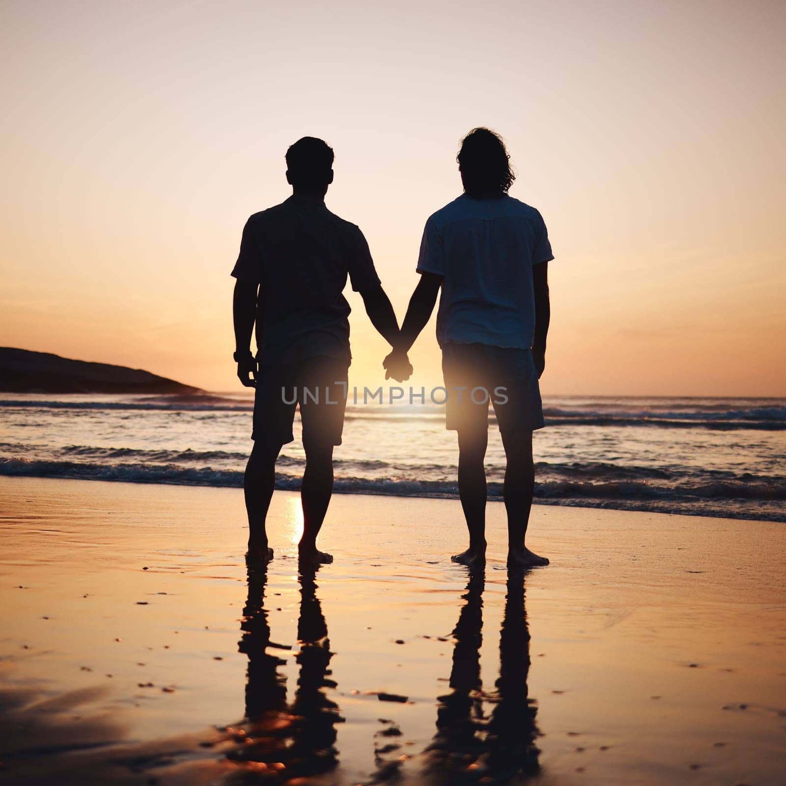 Silhouette, holding hands and gay couple on beach, sunset and shadow on summer vacation together in Thailand. Sunshine, ocean and romance, lgbt men in nature and fun holiday with pride, sea and waves.