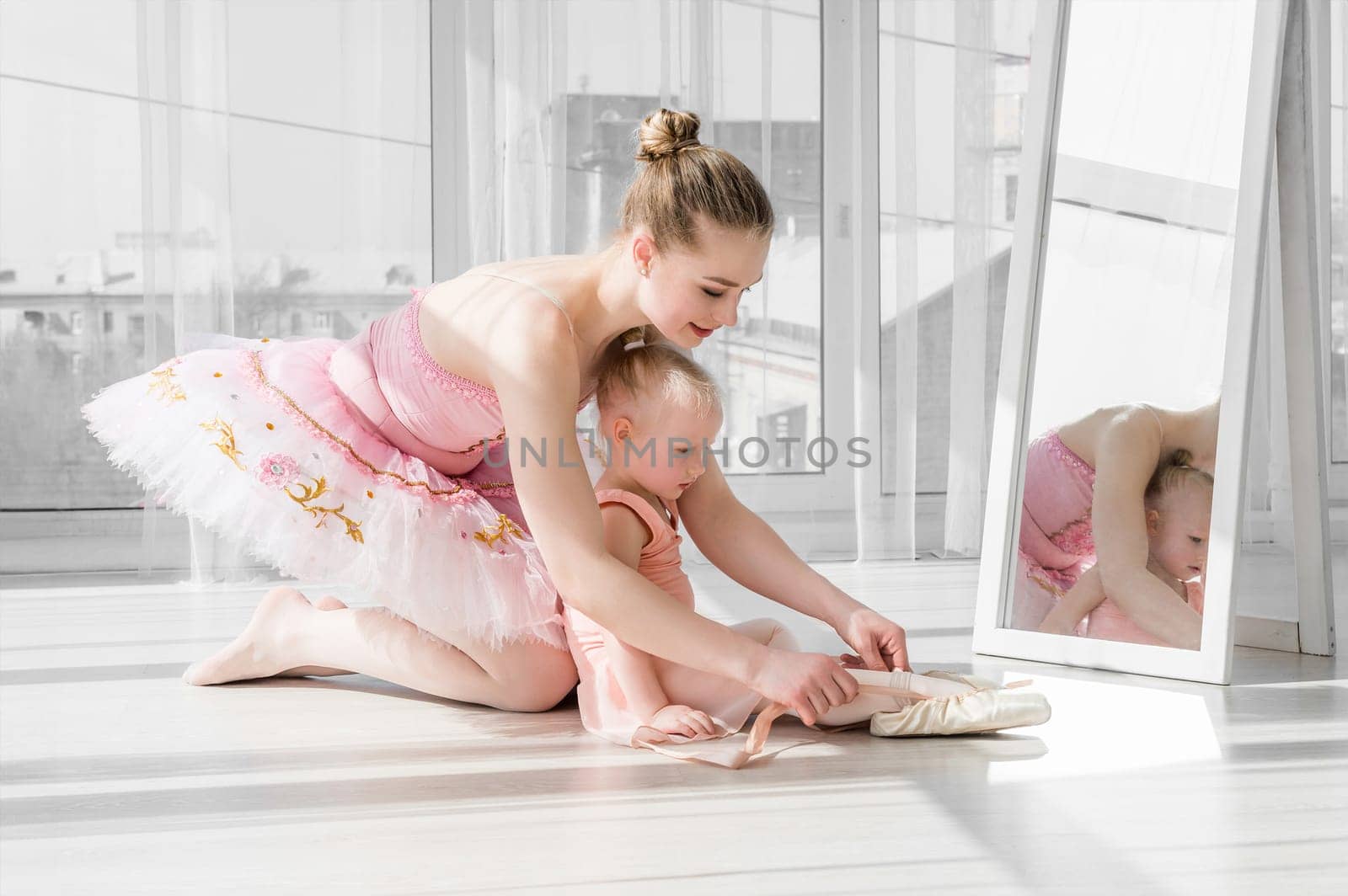 Two ballerinas sitting on the split by tan4ikk1