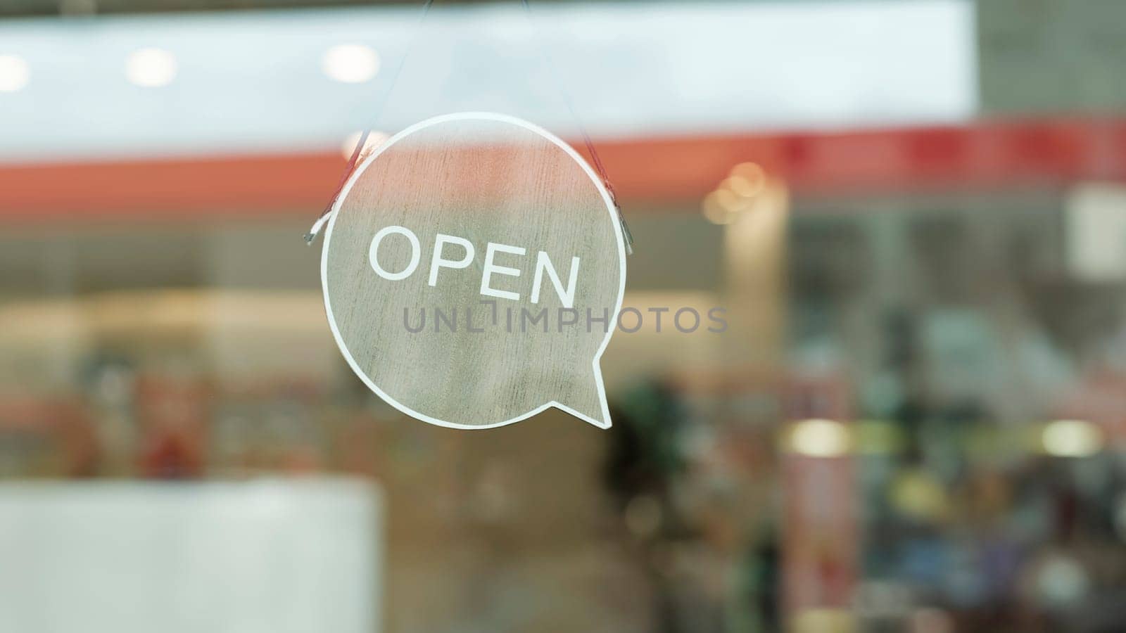 We are open sign hanging on the entrance door of a small cafe. by ijeab