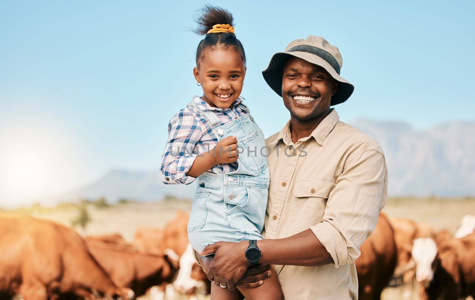 Animals, father and daughter or family on farm outdoor for cattle, holiday and travel. Happy black man and child smile on a field for farmer adventure or trip in countryside with cows in Africa.