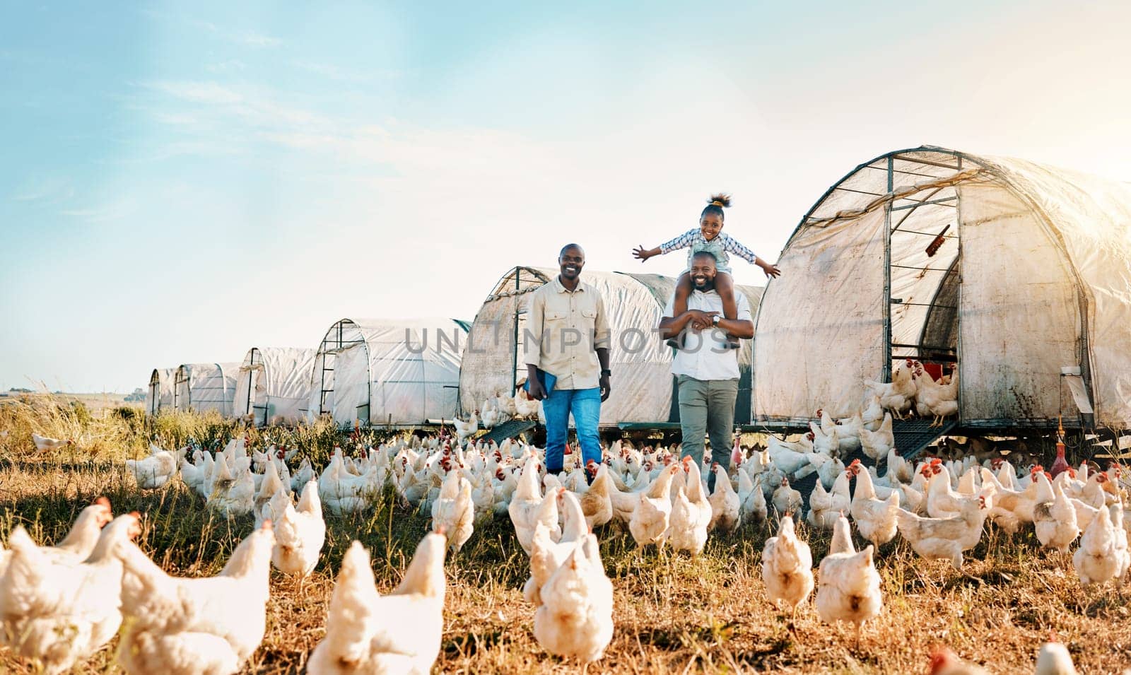 Freedom, gay couple and chicken with black family on farm for agriculture, environment and bonding. Relax, happy and love with men and child farmer on countryside field for eggs, care and animals.