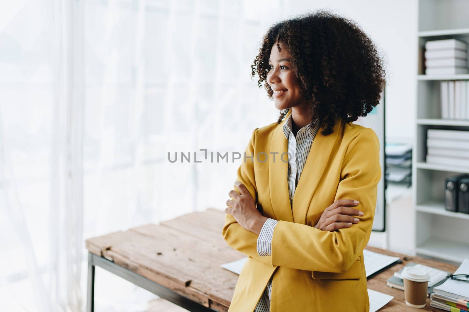 American African business woman using document, computer laptop, calculator, paperwork, documents, in winner and smiling Happy to be successful achievement success. finance and investment concepts by Manastrong