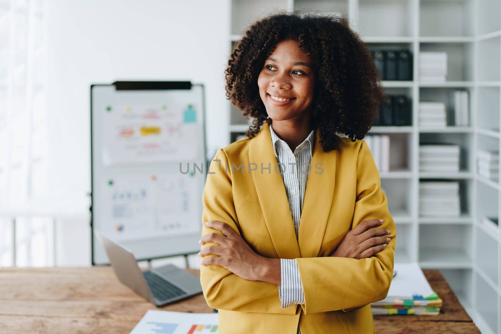 American African business woman using document, computer laptop, calculator, paperwork, documents, in winner and smiling Happy to be successful achievement success. finance and investment concepts by Manastrong