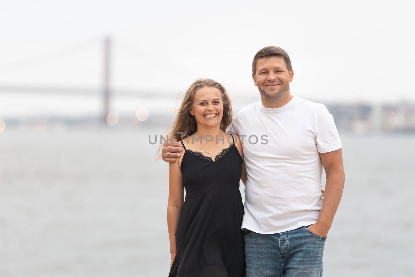 Cute adult married couple standing on the pier by Studia72