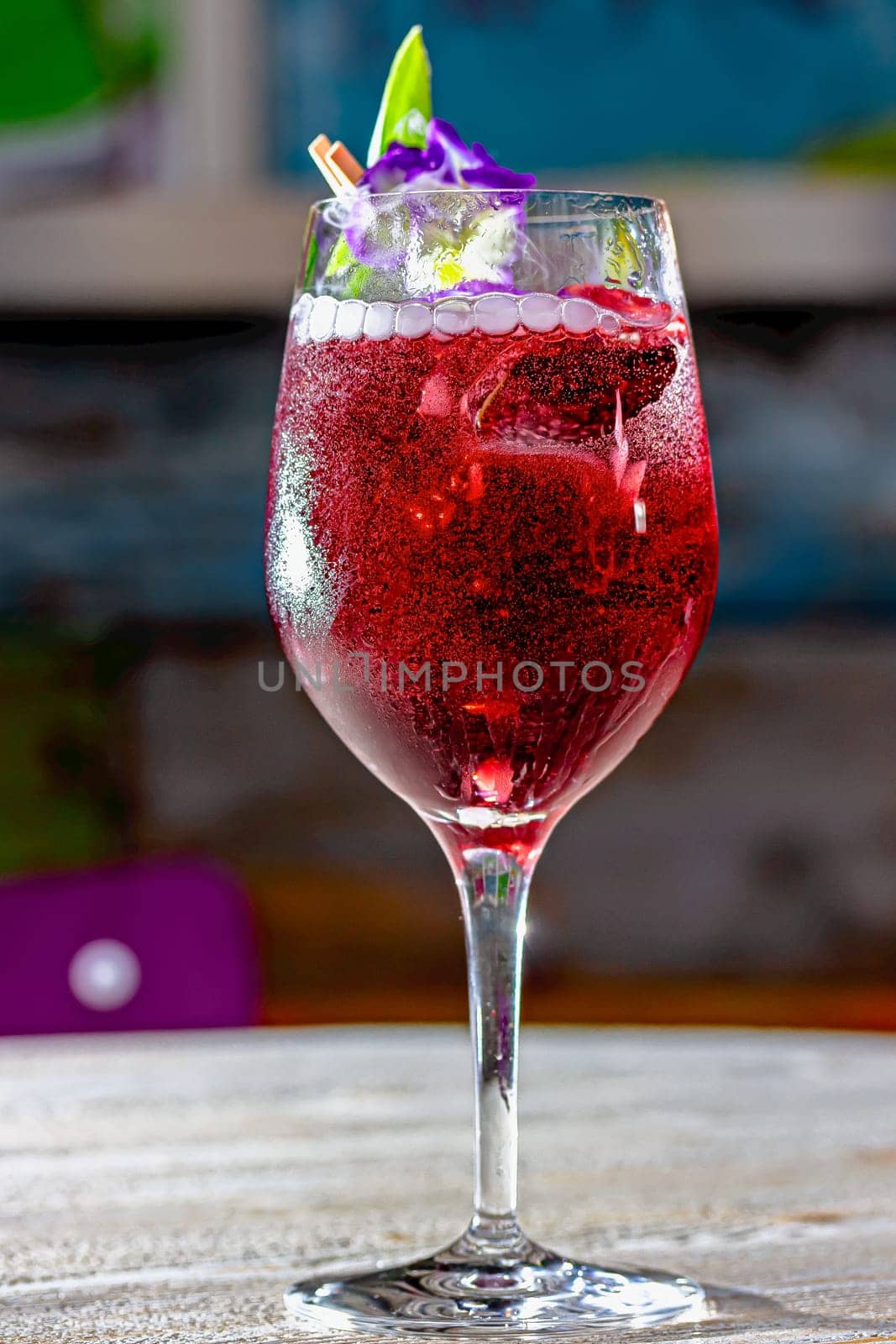 red cocktail with sparkling wine aperol whiskey juice bar by Milanchikov