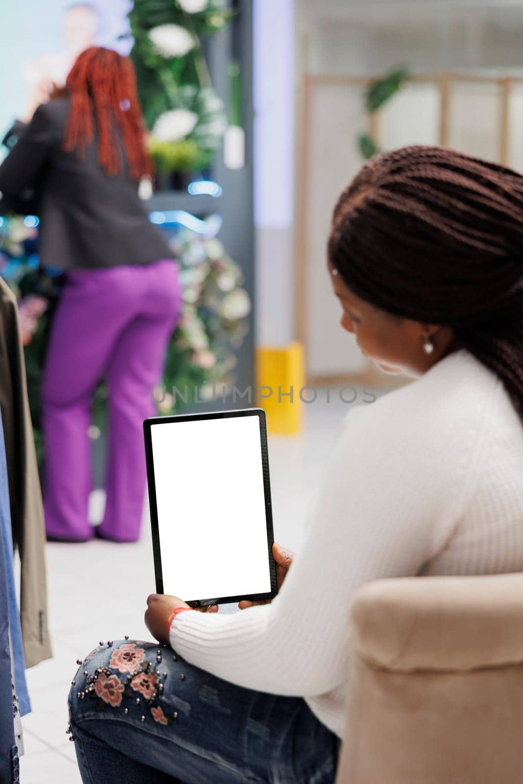 Woman using tablet mock up in fashion boutique by DCStudio