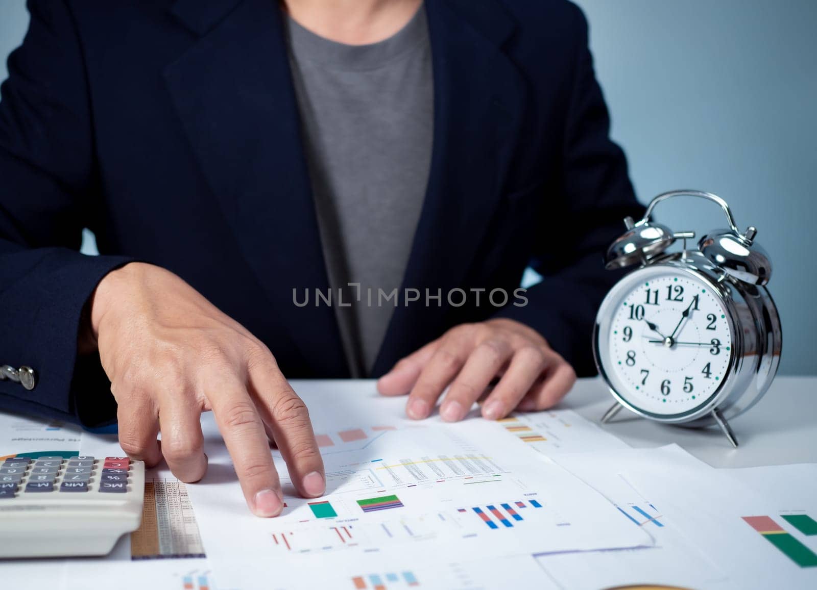 Businessman calculating income To fill out an online personal income tax return form to pay taxes. Financial research. Report. Tax return. Calculation. by Unimages2527