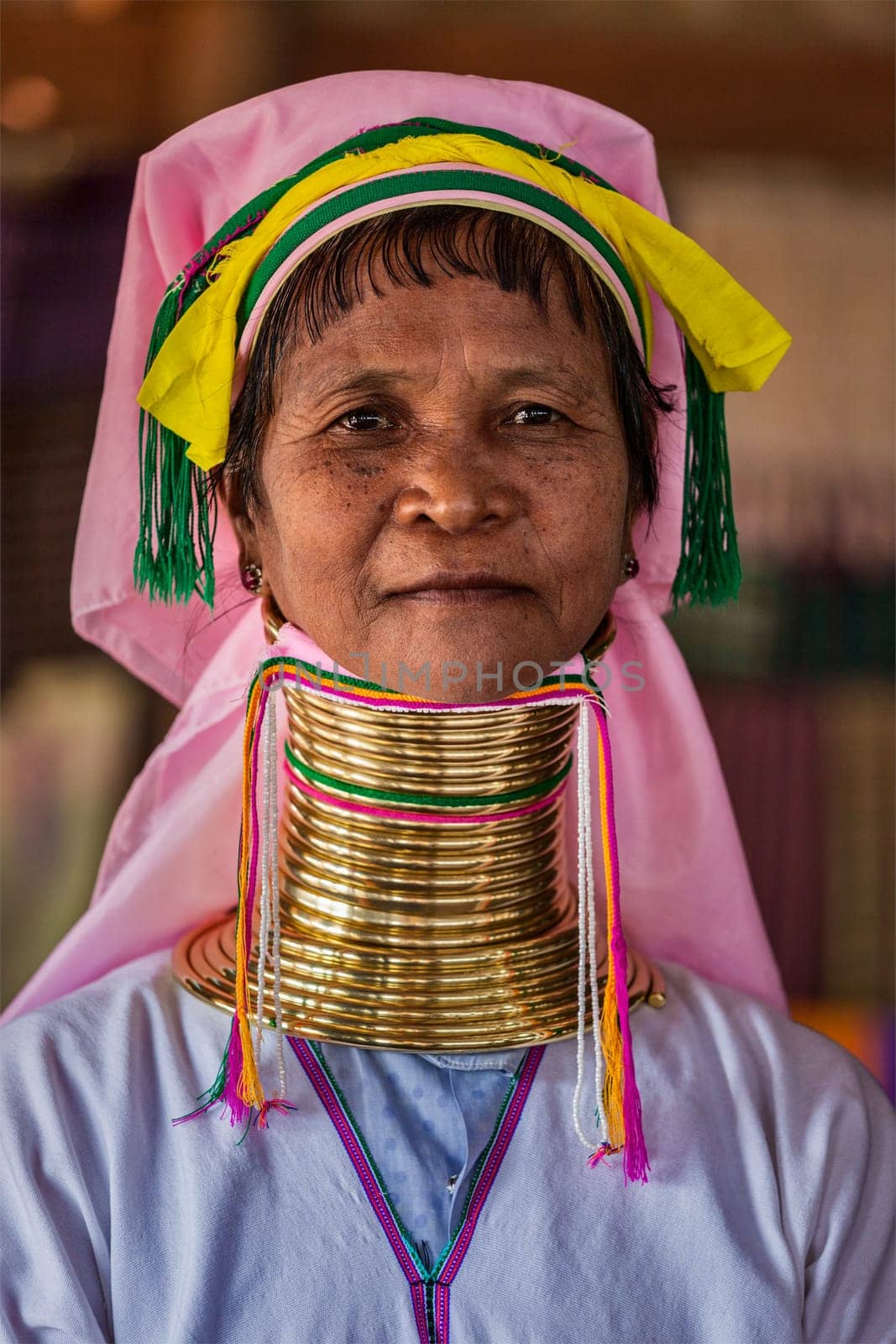 Padaung long-necked tribe woman. The Padaung long-necked tribe women wear brass rings around neck by dimol