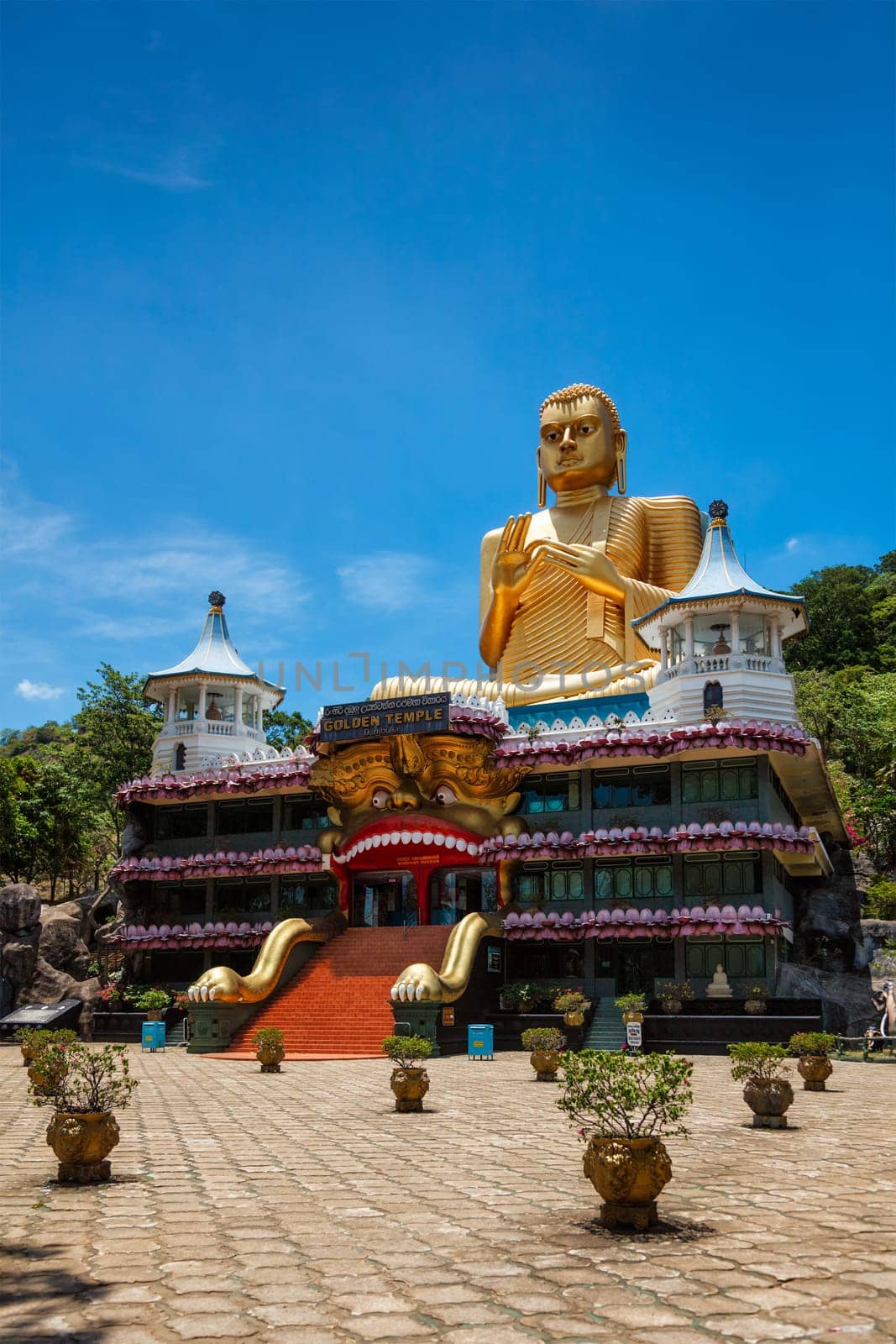 Golden Buddha temple with gold Buddha on roof, Dambulla, Sri Lanka by dimol