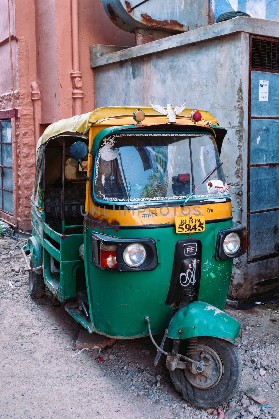 Jodhpur, India - November 13, 2019: Auto rickshaw tuk tuk in indian street is a very common transportation option in India used as taxi. Jodhpur, Rajasthan, India