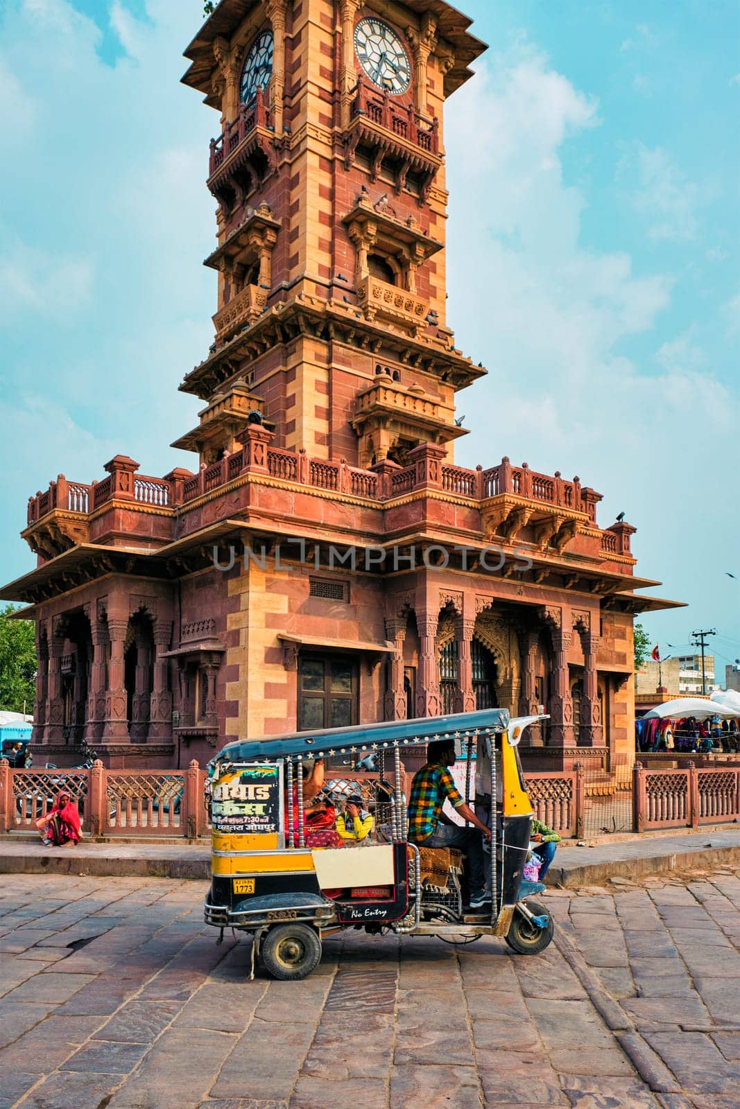 Jodhpur, India - November 14, 2019: Traffic at indian street in Sadar market near Clock Tower Ghanta Ghar. Jodhpur, Rajasthan, India