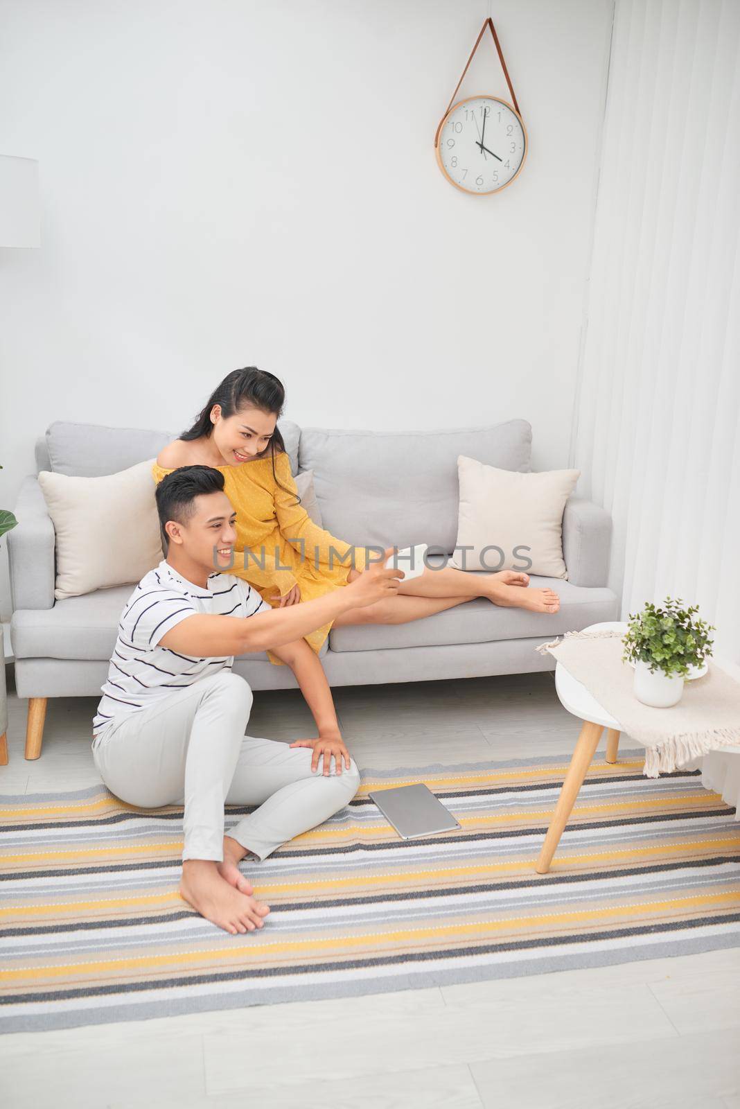 Leisure time. Handsome man expressing positivity while spending time with his female, taking photo