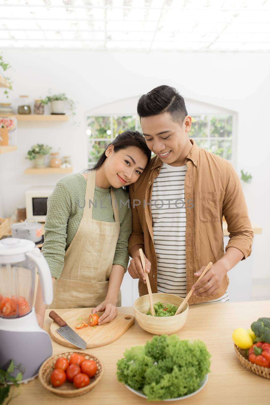  Young asian man and woman have romantic time while staying at home.