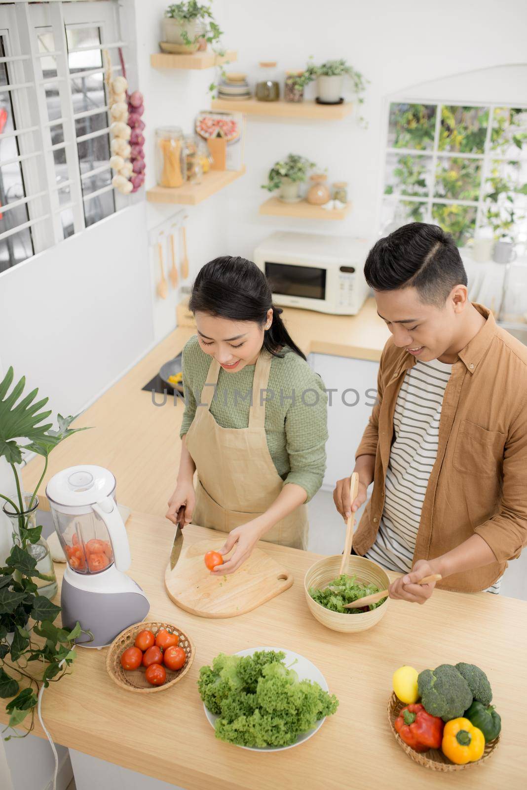  Young asian man and woman have romantic time while staying at home.