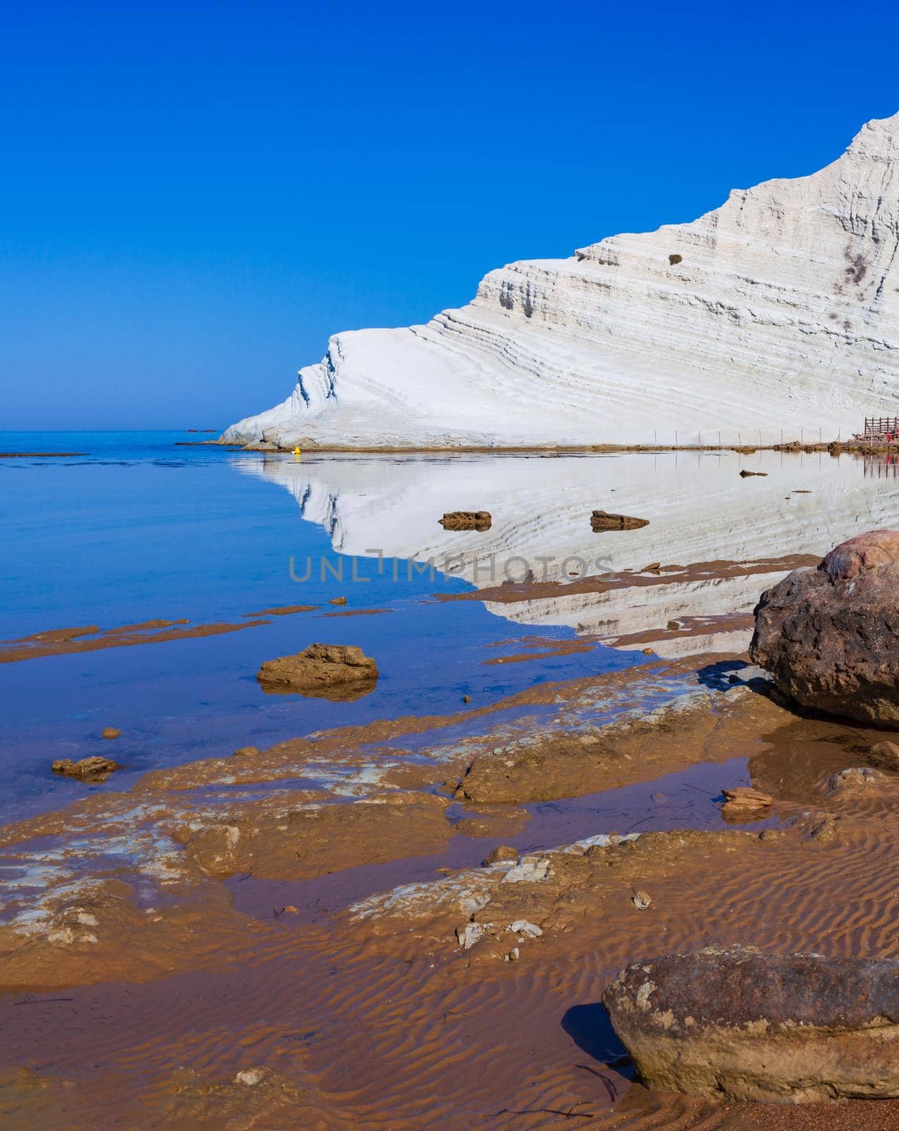 View of the limestone white cliffs with beach at the Scala dei Turchi in English Stair of the Turks near Realmonte in Agrigento province. Sicily, Italy