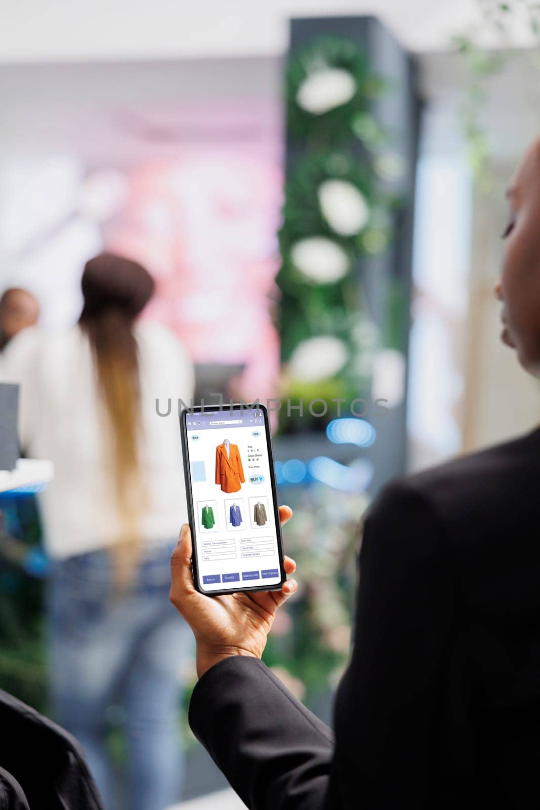 Shopper using online store mobile app by DCStudio