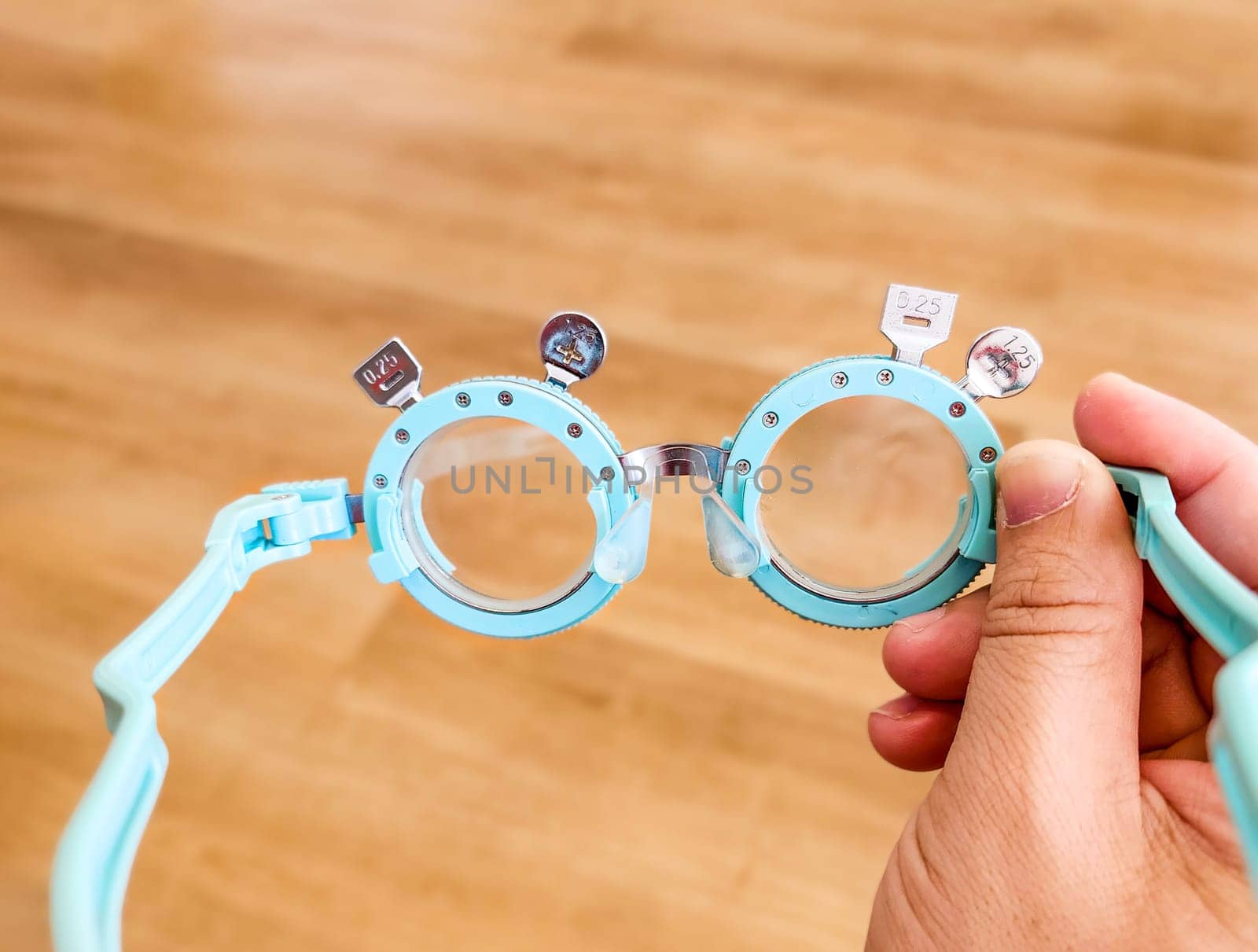 Optometrist . Eye test frame. Vision test. Check Eyesight. Diopter with scale of measurement. Examination of the eyes at eyeglass shop. by samunella