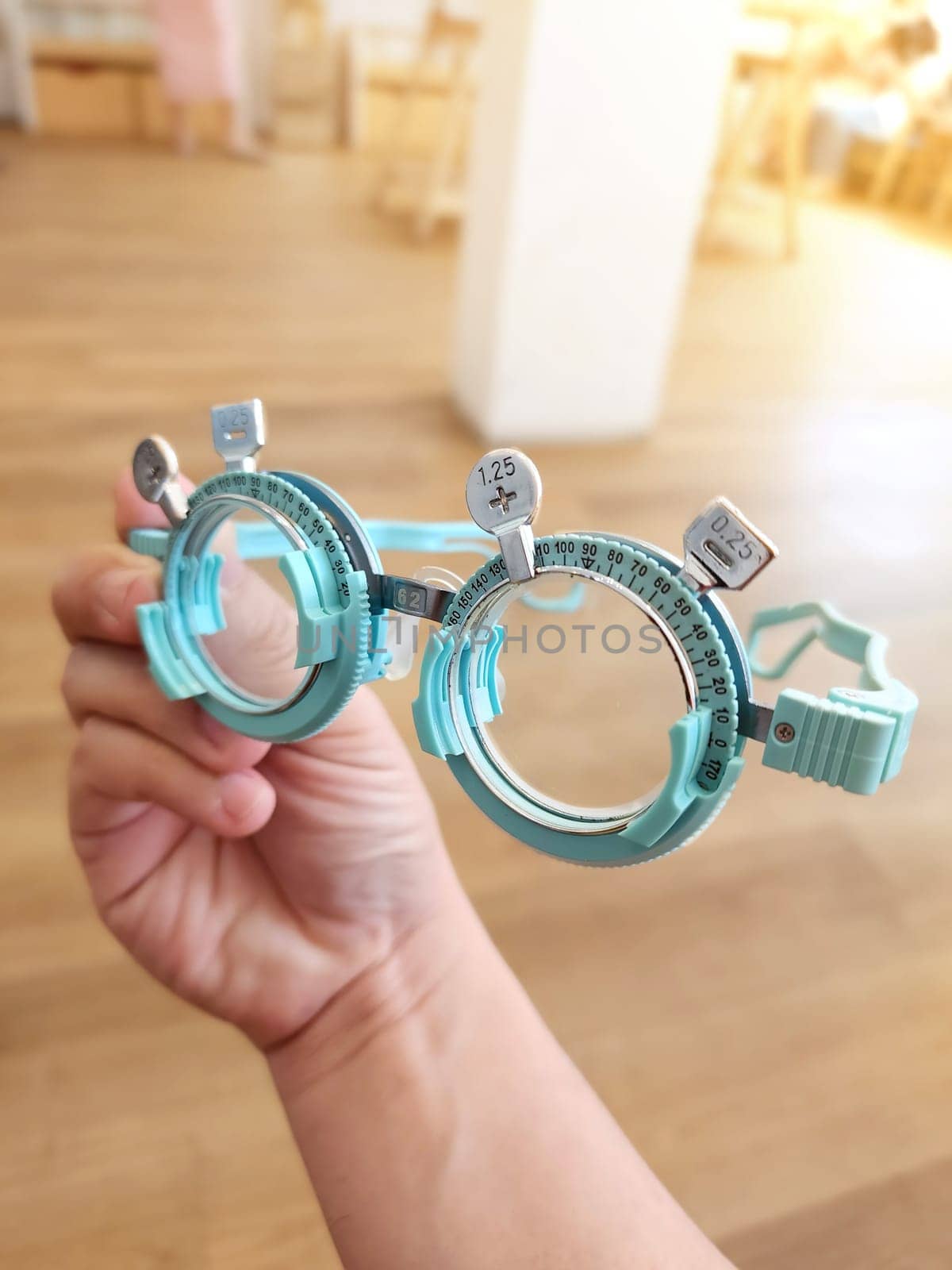 Optometrist . Eye test frame. Vision test. Check Eyesight. Diopter with scale of measurement. Examination of the eyes at eyeglass shop. by samunella