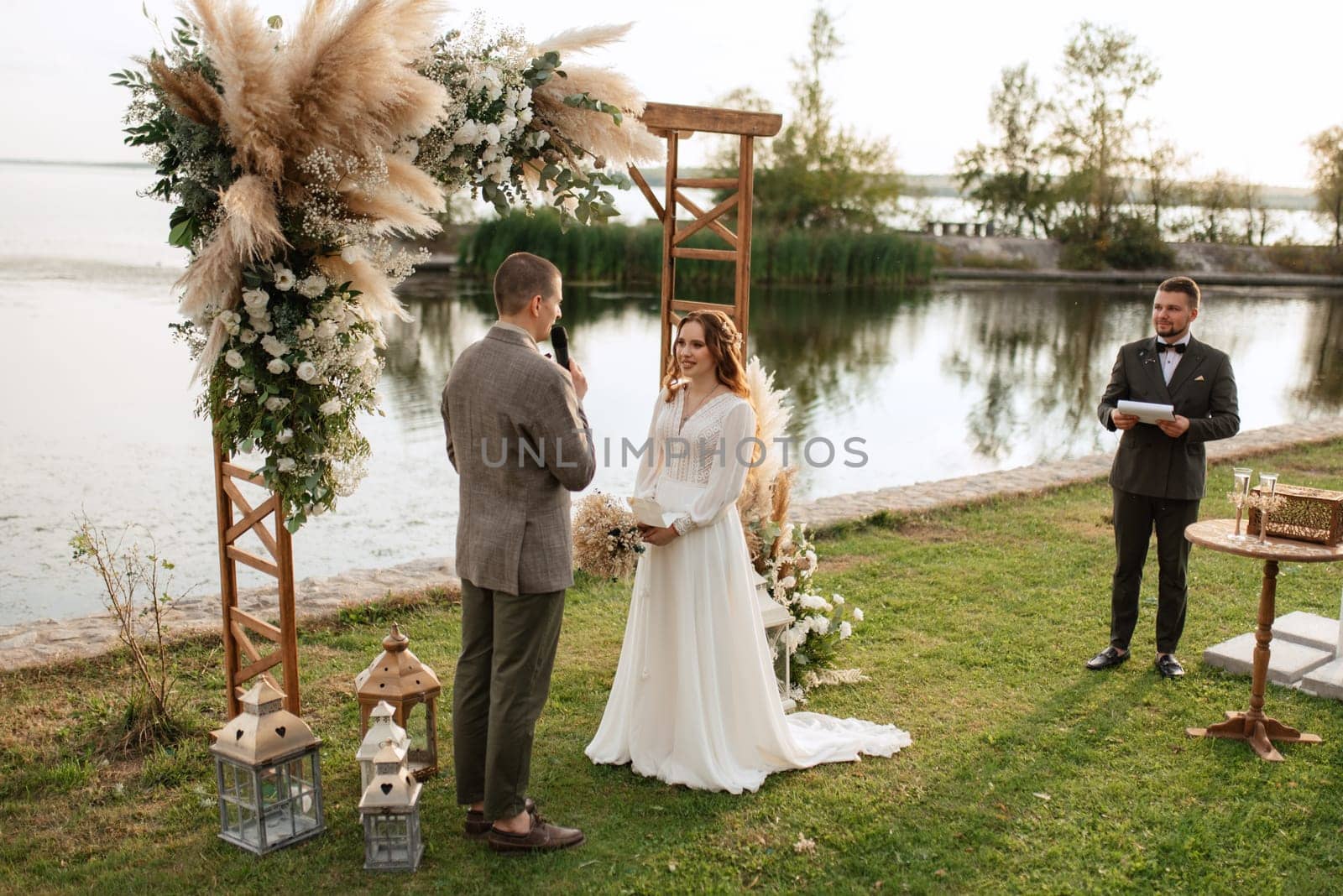 wedding ceremony of the newlyweds in a country cottage by Andreua