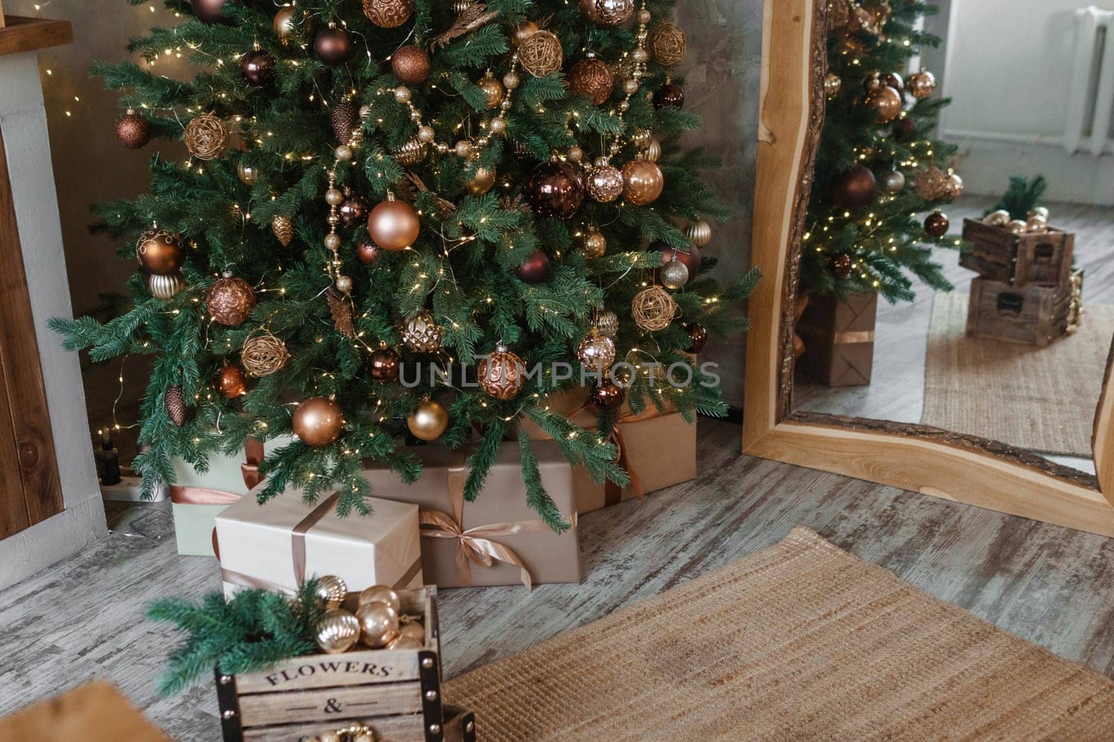 Bronze balls on the Christmas tree close-up. Christmas tree design decorations. The concept of celebrating New Year and Christmas