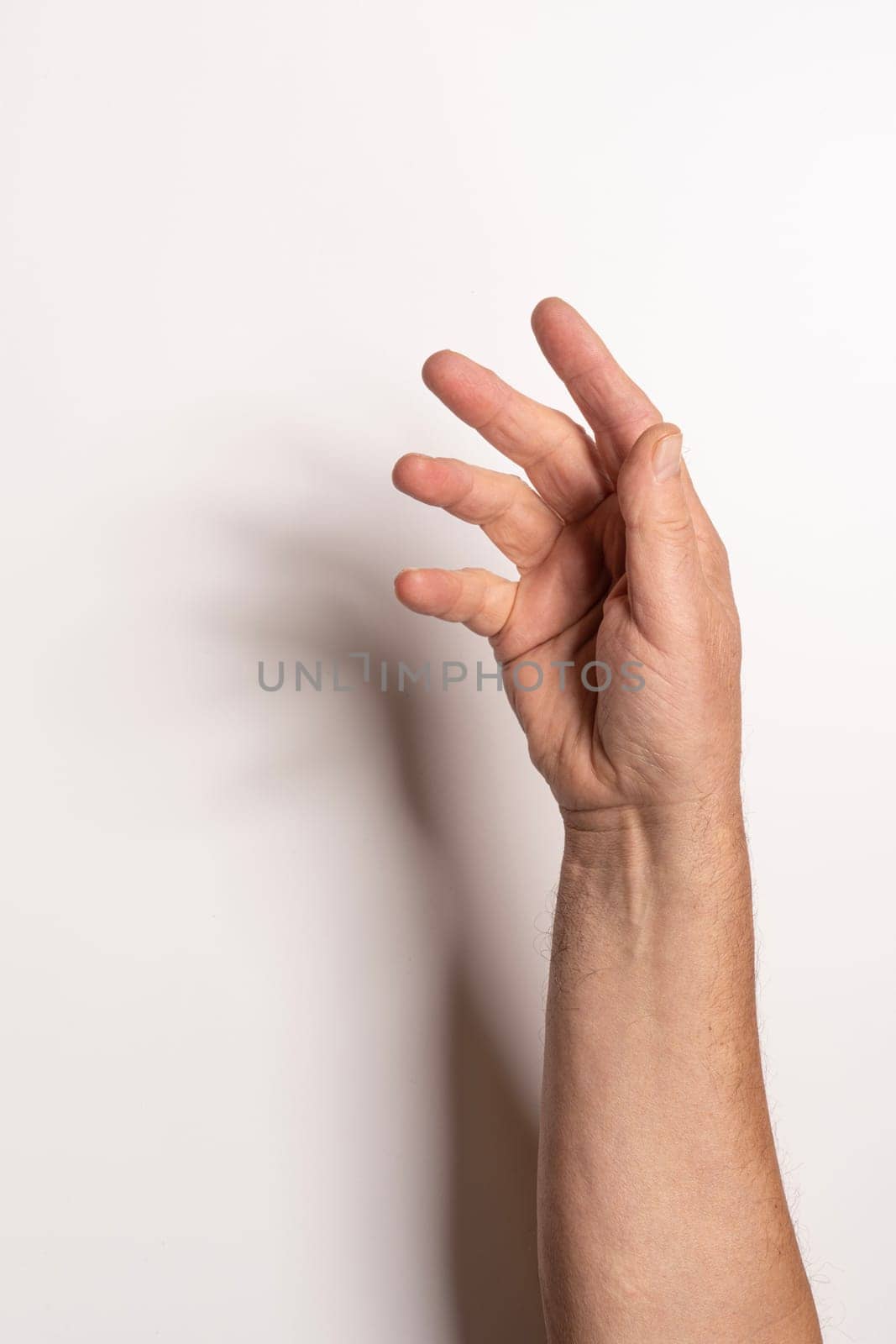 a male hand on a white background