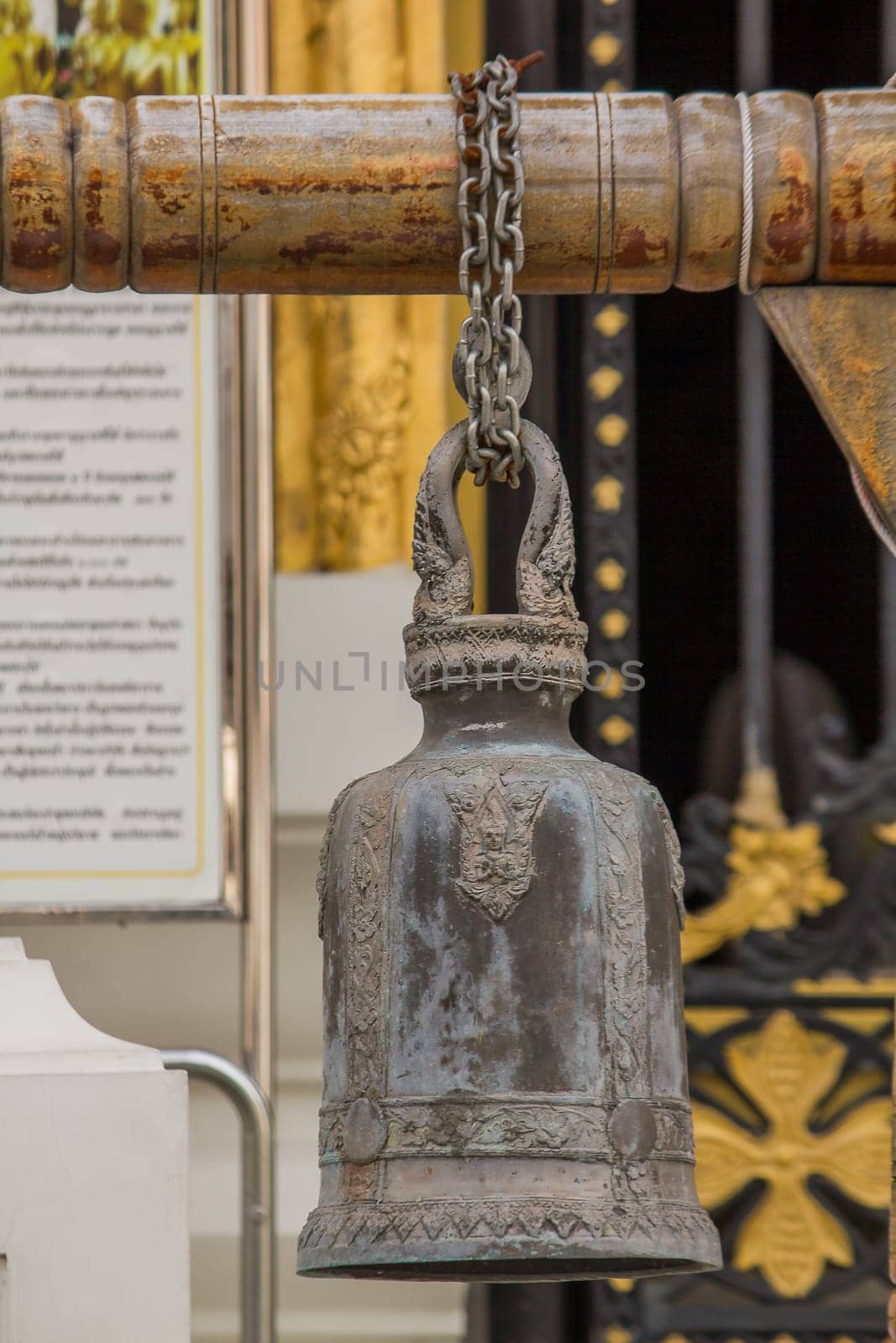 Big brass bells are commonly hung in Thai temples.