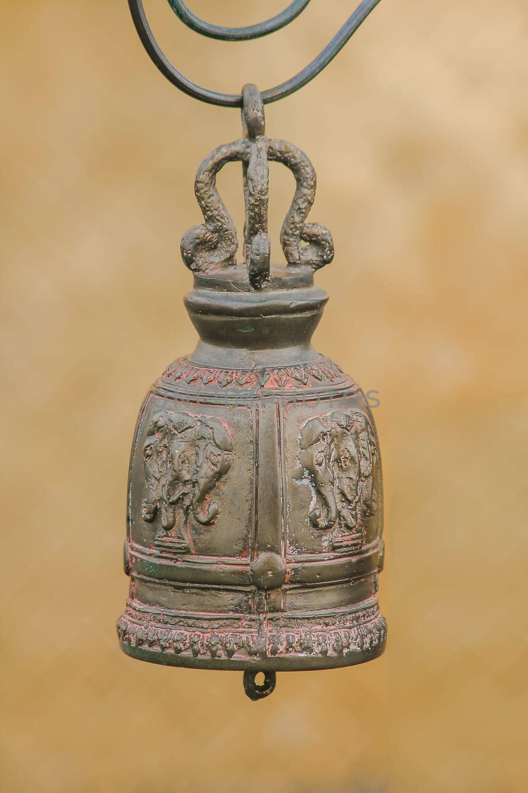 Big brass bells are commonly hung in Thai temples.