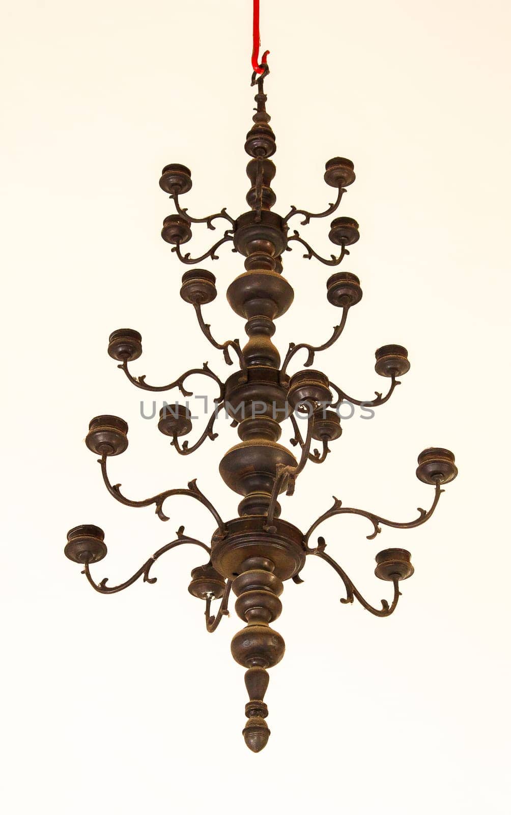 Candlestick, old brass, hanging on the ceiling