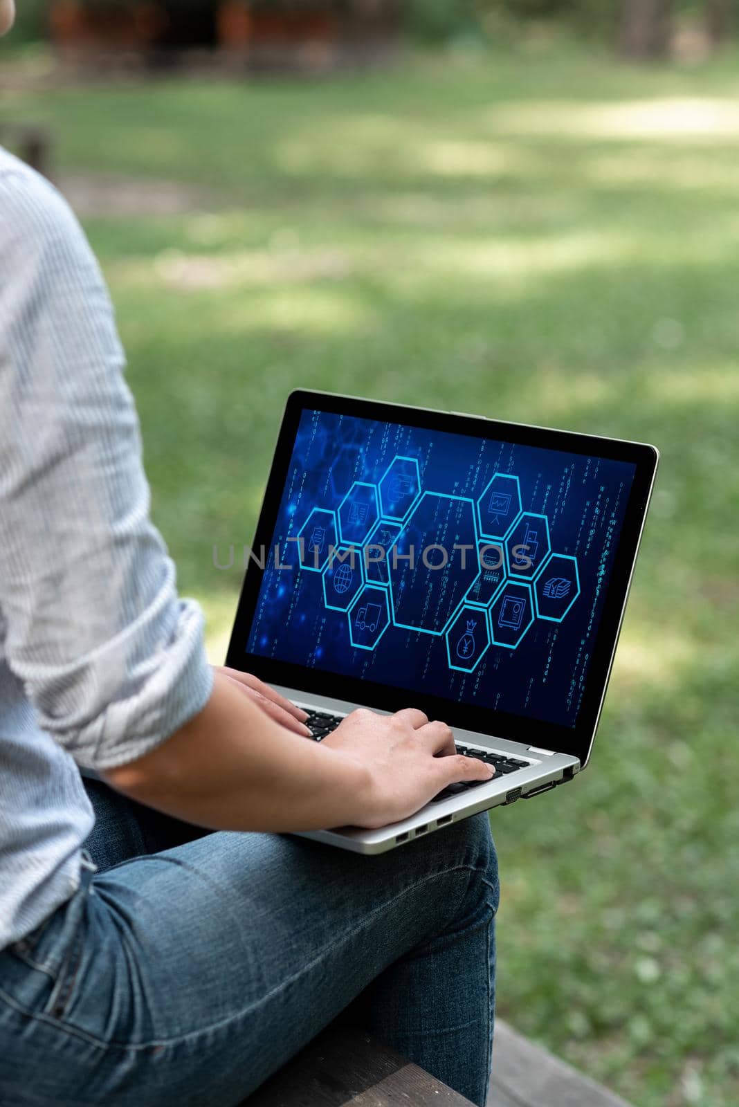 Woman Typing On Laptop Sitting Outside Side View Working From Home.