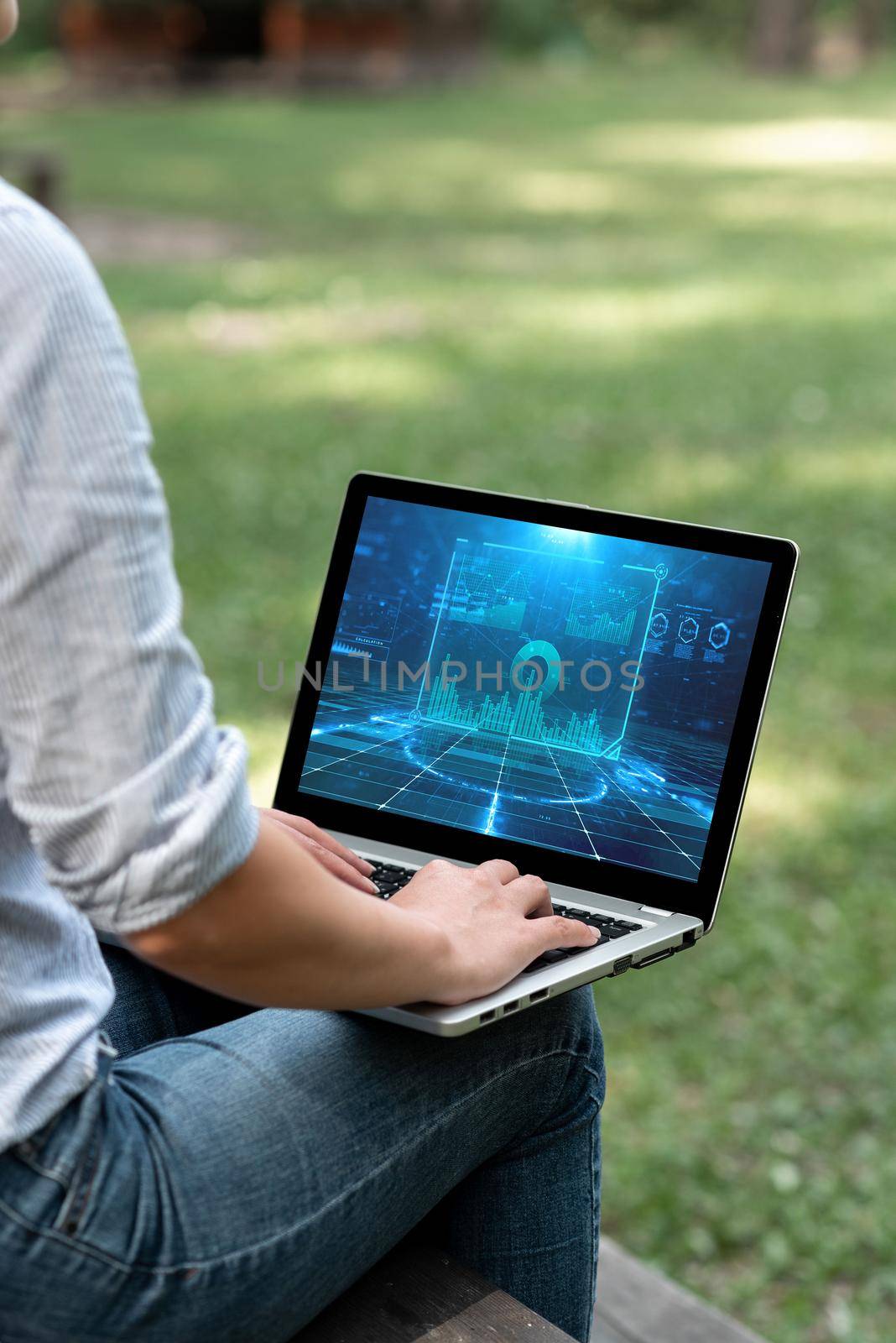 Woman Typing On Laptop Sitting Outside Side View Working From Home.