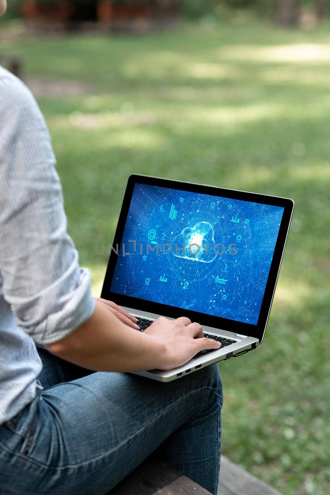 Woman Busy Typing On Laptop Sitting Outside Her Garden Side View Actively Accomplishing Work From Home. Girl Staying Alone Outdoors Finishing Remote Job Projects. by nialowwa