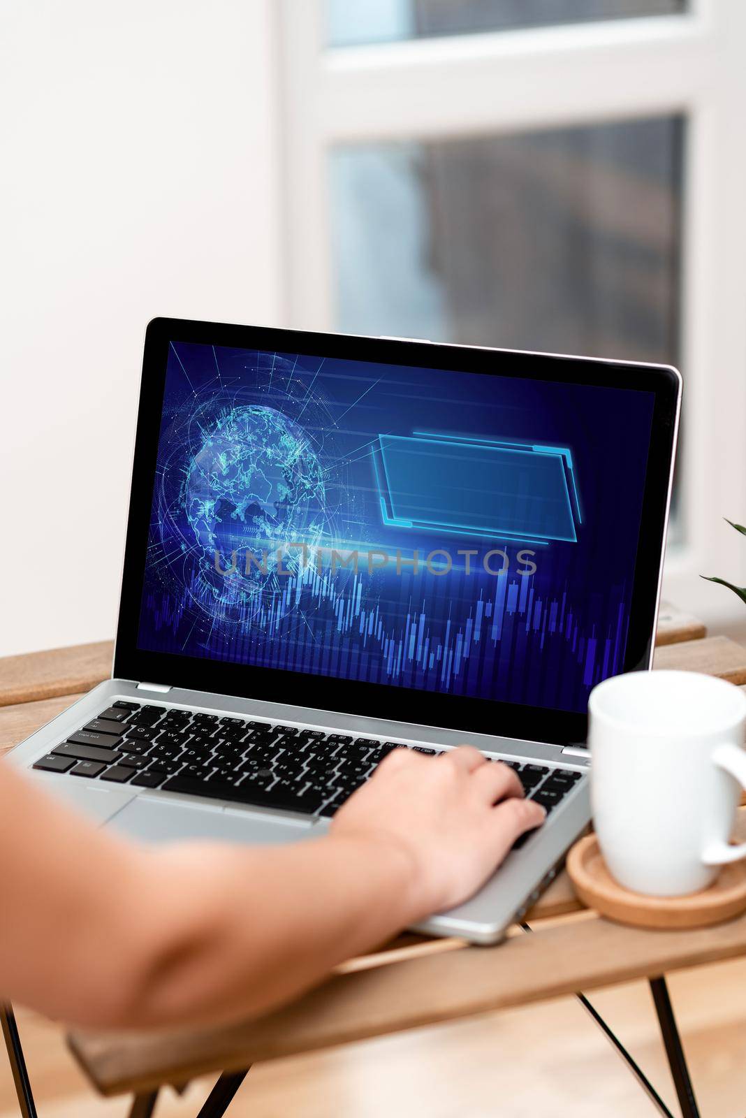 Hand Resting On Laptop Top Of Table Beside Cup Working From Home.