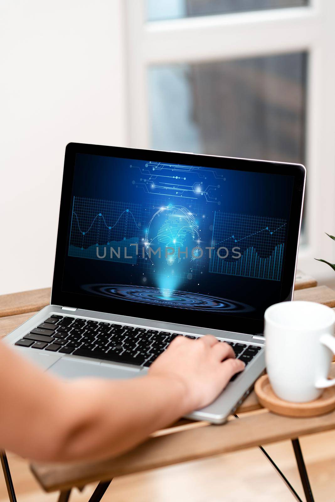 Hand Resting On Laptop Top Of Table Beside Coffee Mug Actively Accomplishing Work From Home. Arm Making New Tasks Next To Cup Finishing Remote Job Projects. by nialowwa