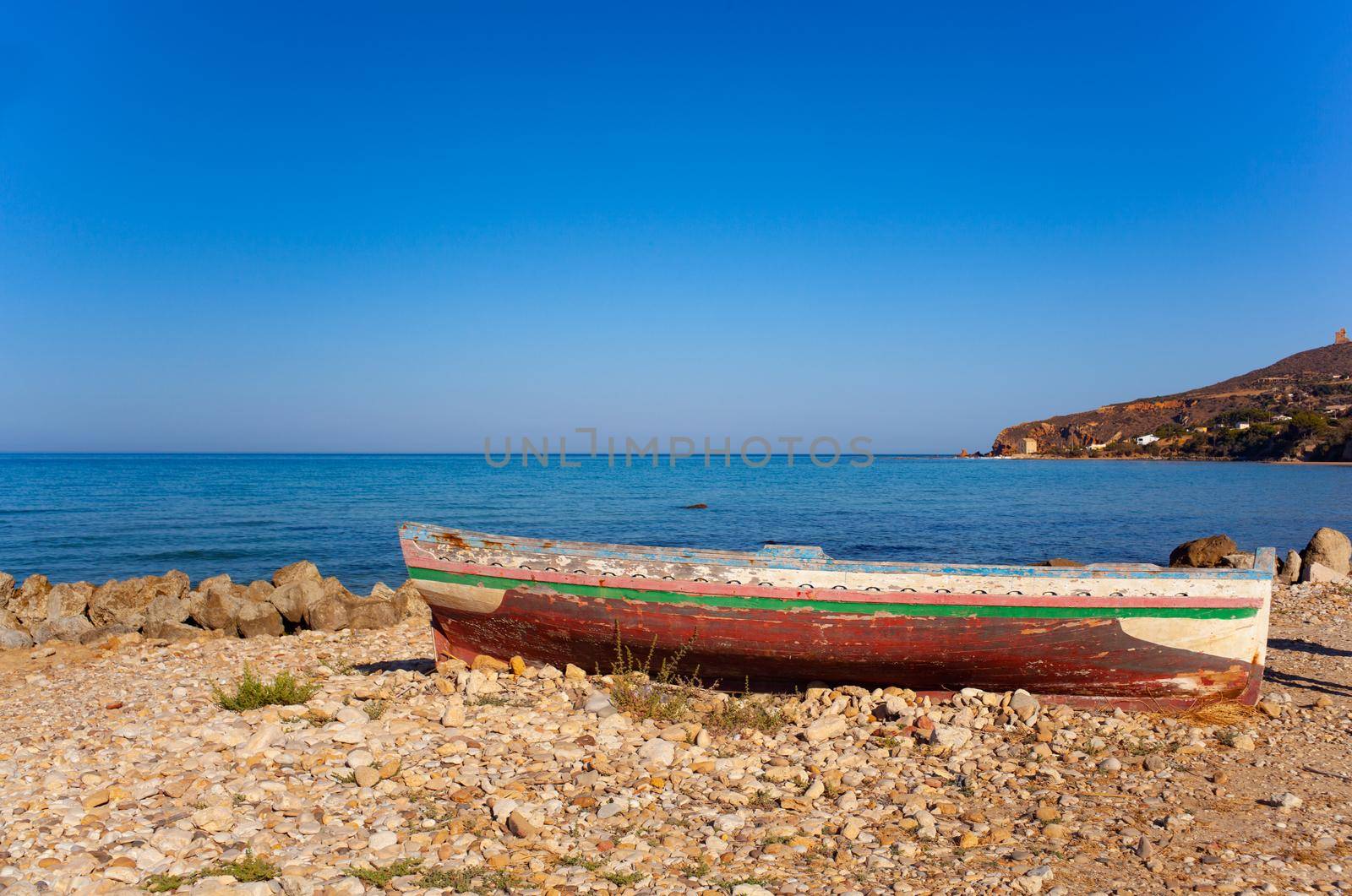 A Broken migrant boat stranded on the beach of the Agrigento coast