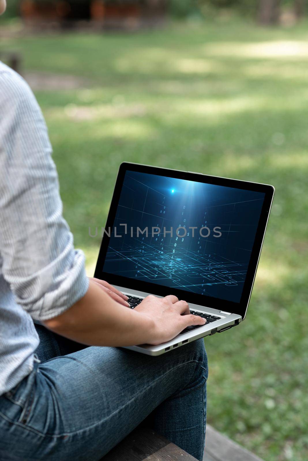 Woman Busy Typing On Laptop Sitting Outside Her Garden Side View Actively Accomplishing Work From Home. Girl Staying Alone Outdoors Finishing Remote Job Projects. by nialowwa