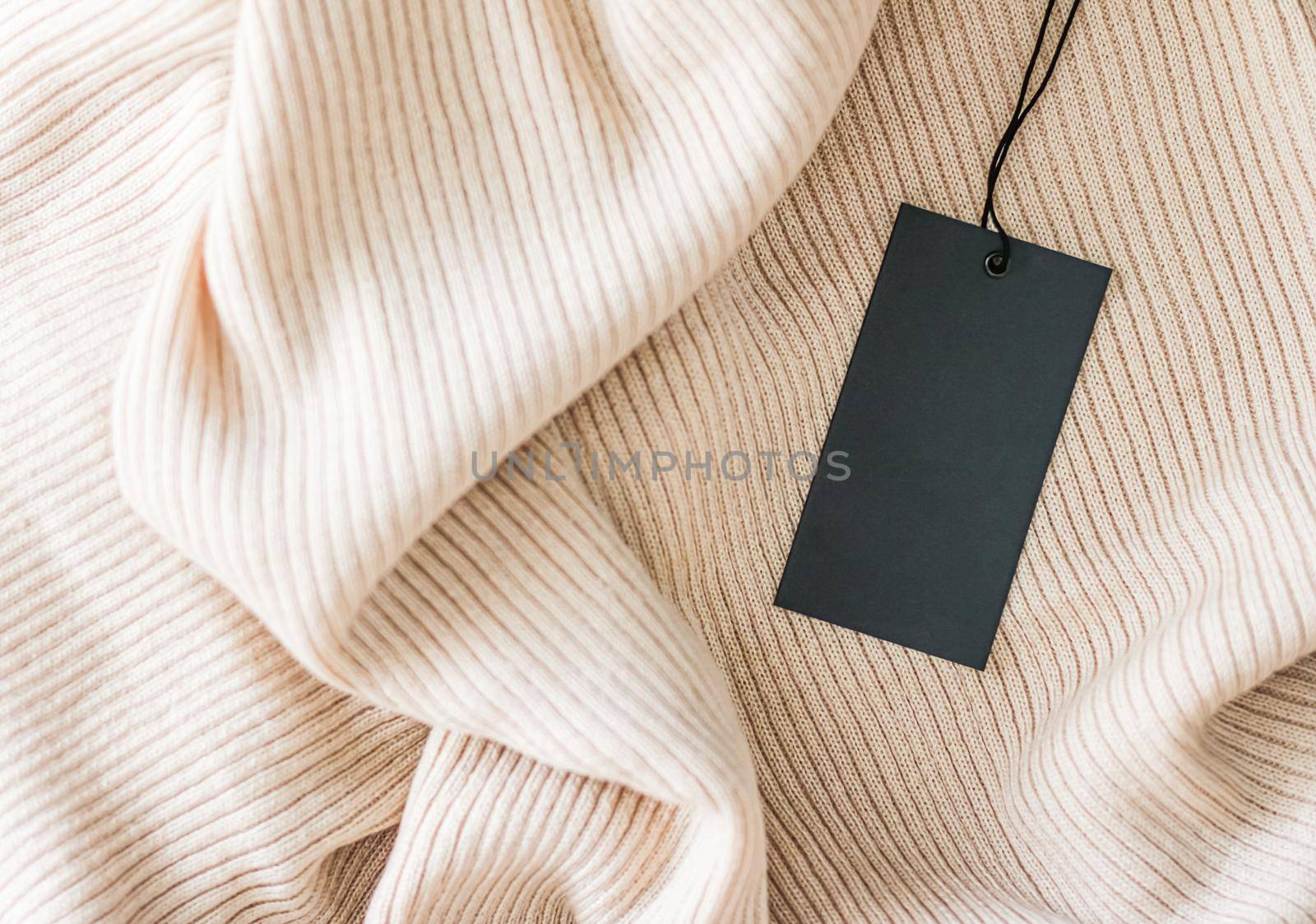 Comfort clothing and black price tag as flatlay background, sustainable fashion and brand label concept.