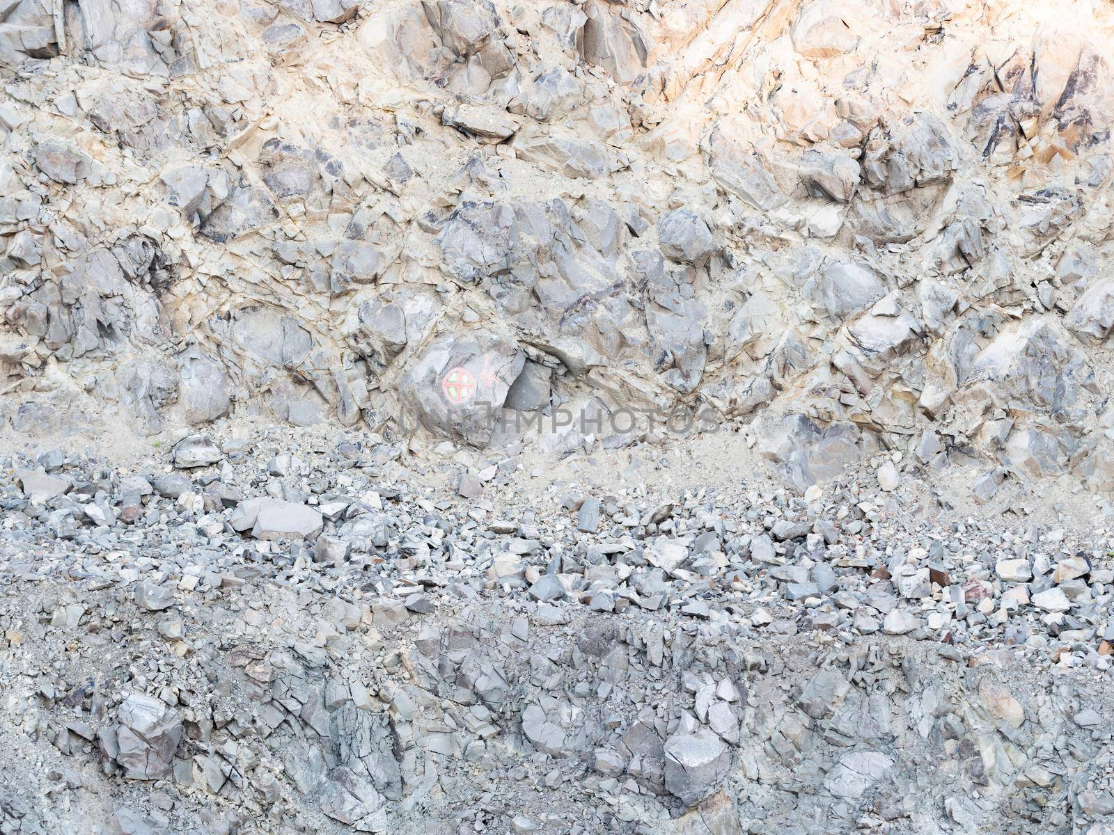 Detail of a stone pit in stone quarry. Industrial site, granite gravel mining in open pit.