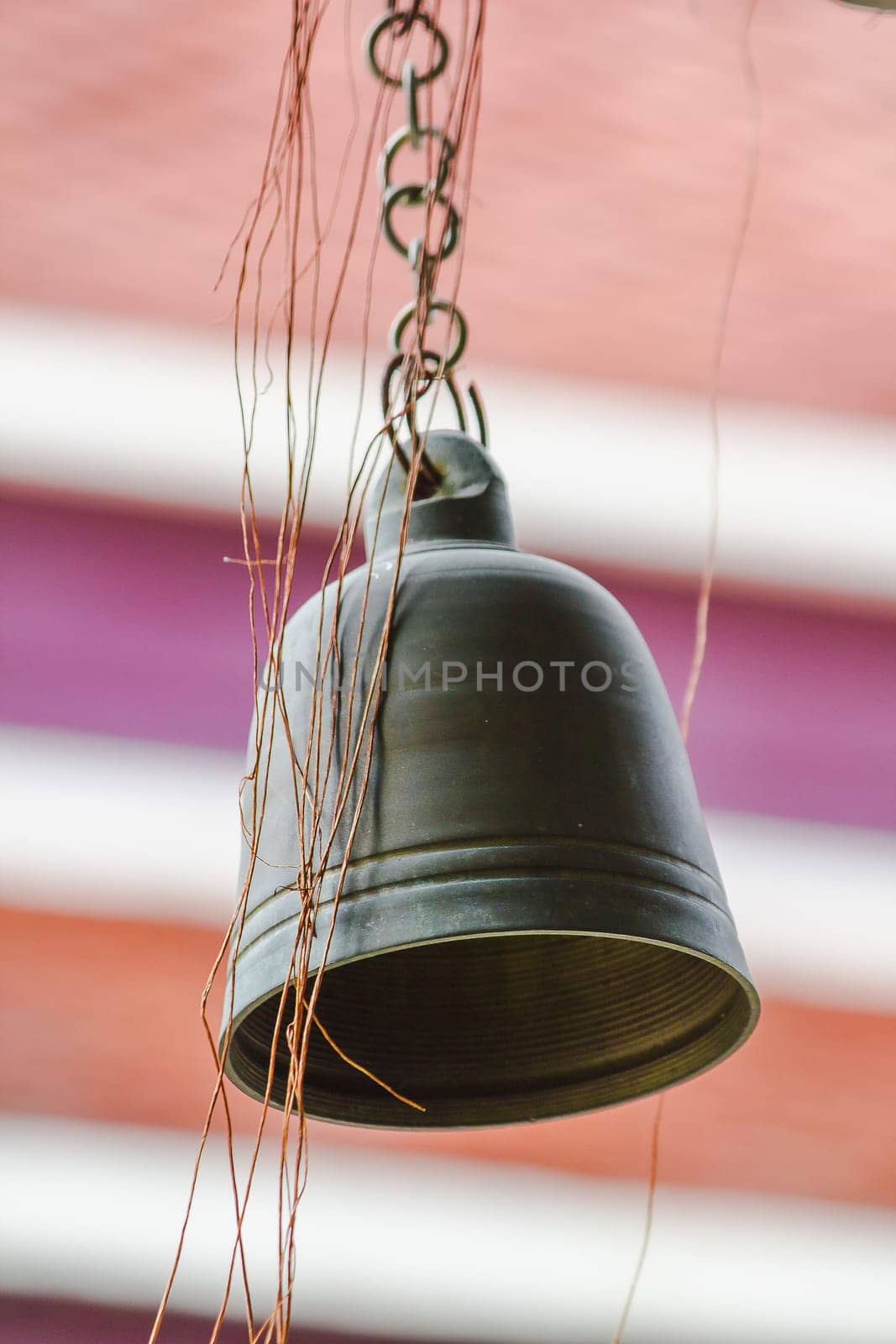 Small brass bells are commonly hung in Thai temples.