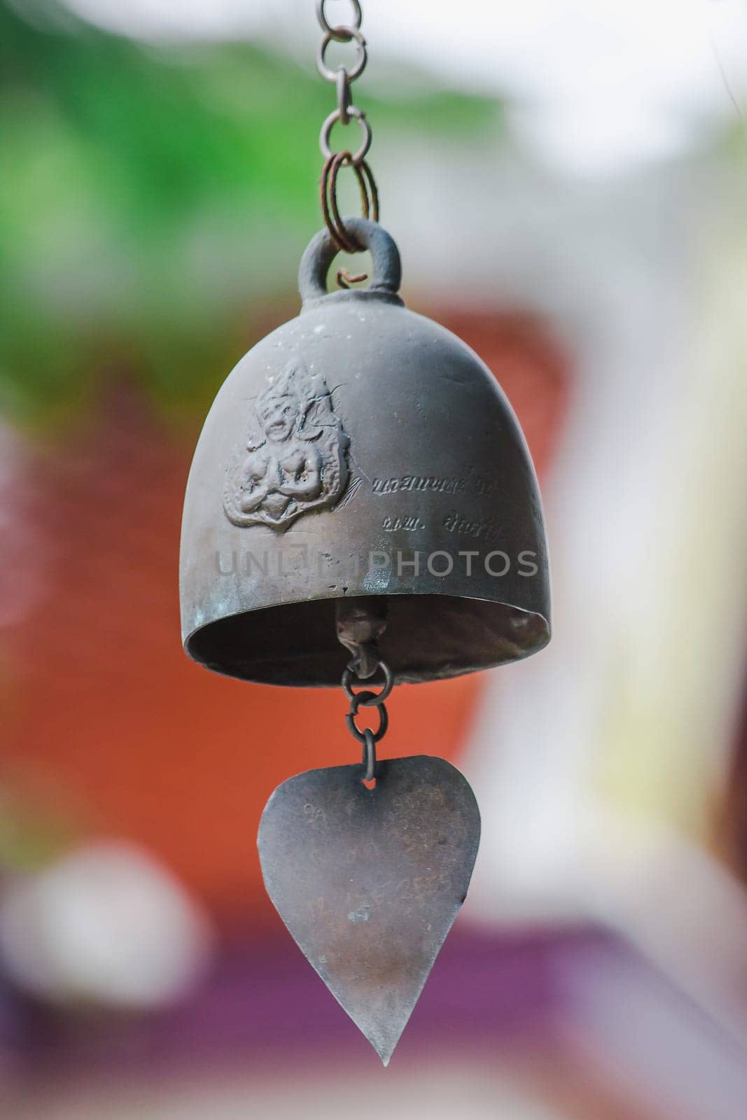 Small brass bells are commonly hung in Thai temples.