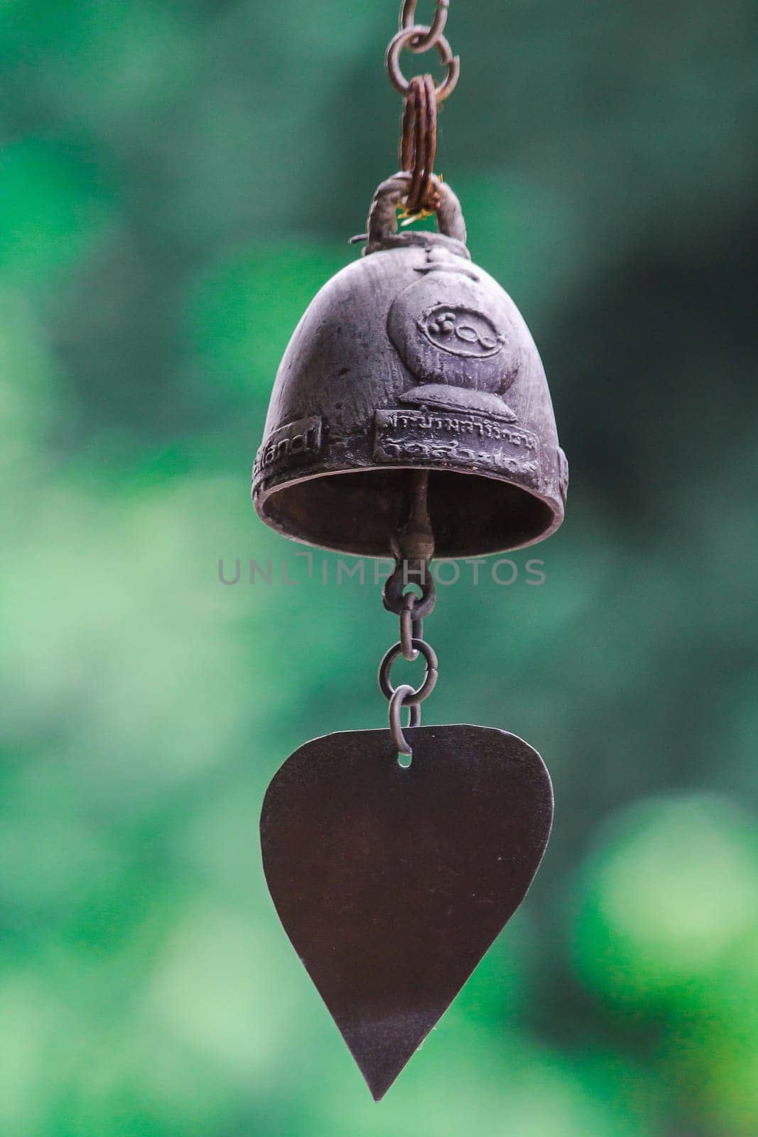 Small brass bells are commonly hung in Thai temples.
