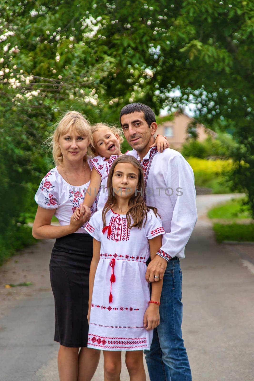 Family Ukrainians in vyshyvanka patriots. Selective focus. Couple.