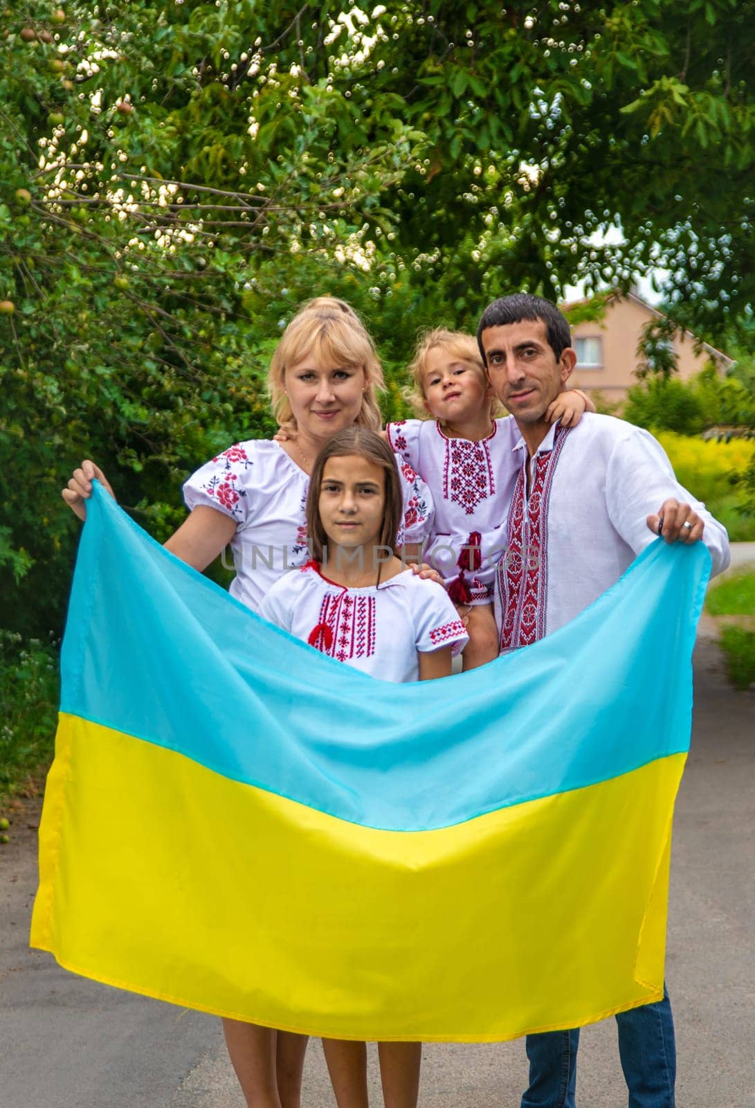 Family Ukrainians in vyshyvanka patriots. Selective focus. Couple.