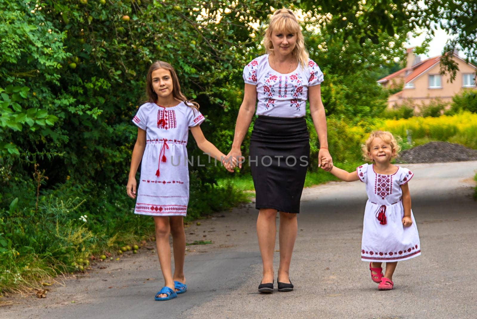 Family Ukrainians in vyshyvanka mother and children. Selective focus. victory,
