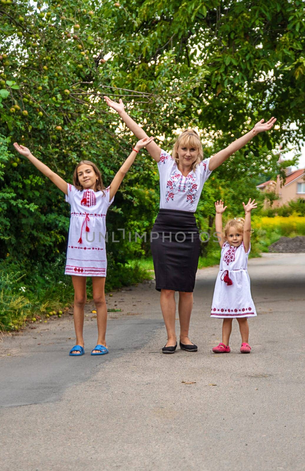 Family Ukrainians in vyshyvanka mother and children. Selective focus. by yanadjana