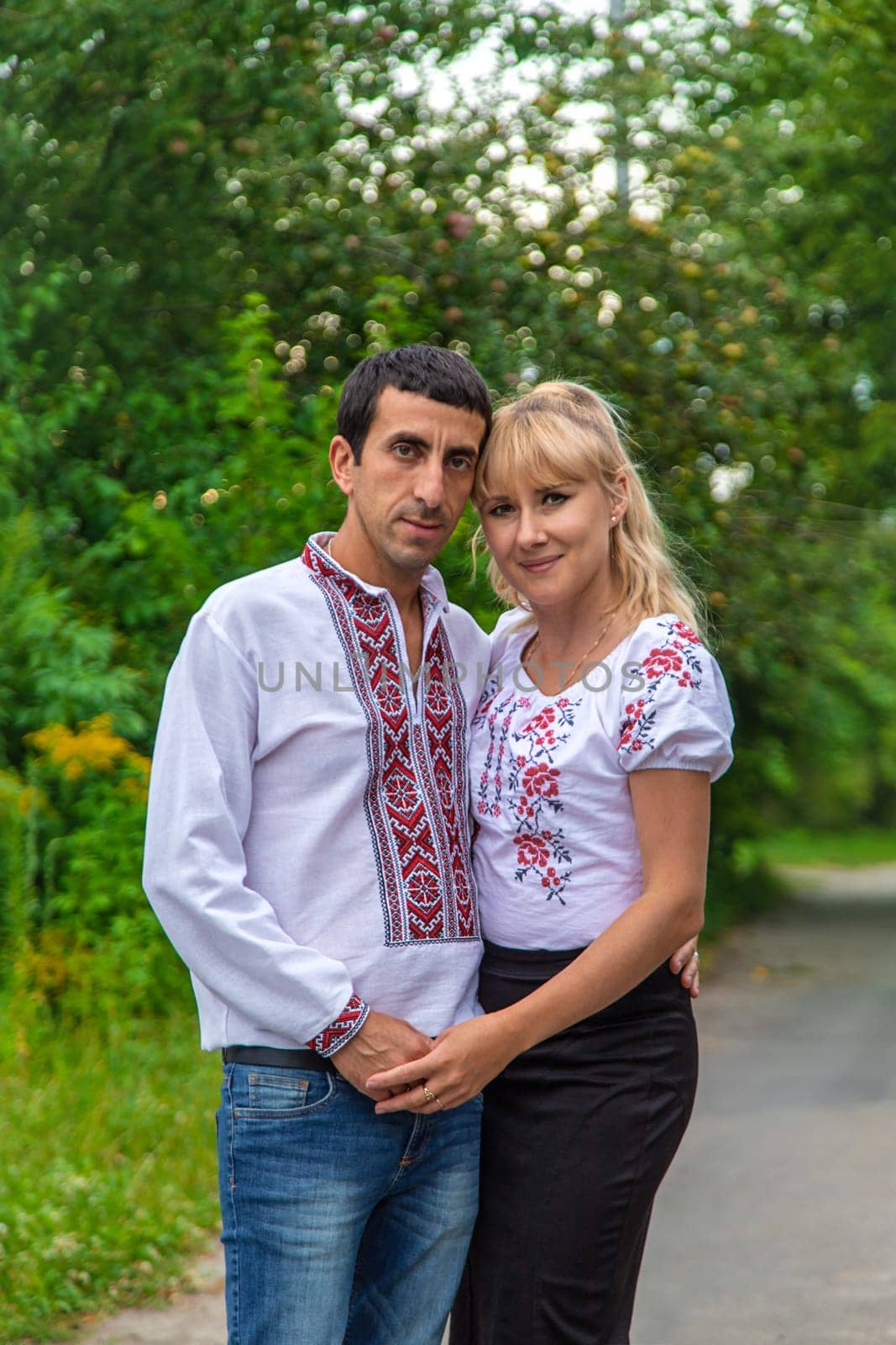 Ukrainian man and woman in vyshyvanka. Selective focus. by yanadjana