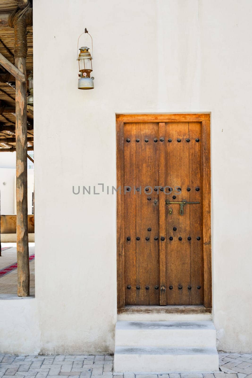 Arabic style carved wooden doors in Al Fahidi Historical District, Deira, Dubai, United Arab Emirates. by Ekaterina34