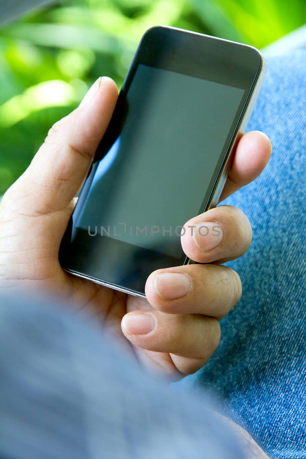 close up of man using smartphone by ponsulak