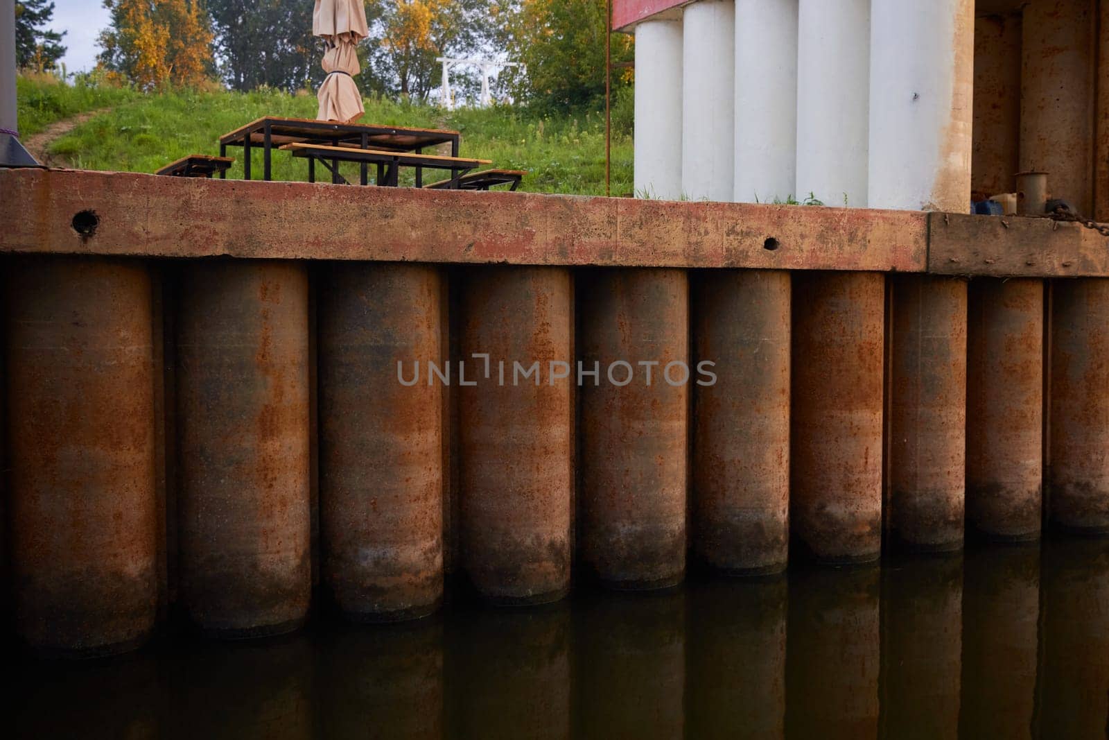 Photo of pontoon column on quay. Metal by electrovenik