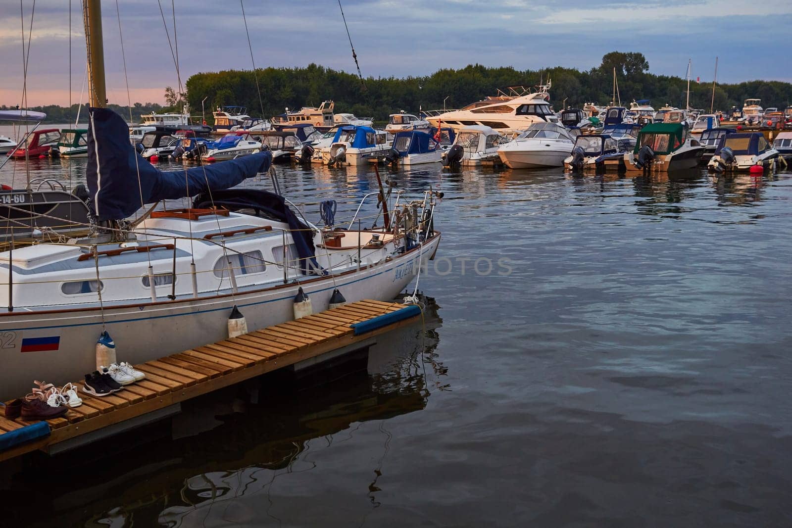 Photo of lot of yachts in backwater on water. by electrovenik