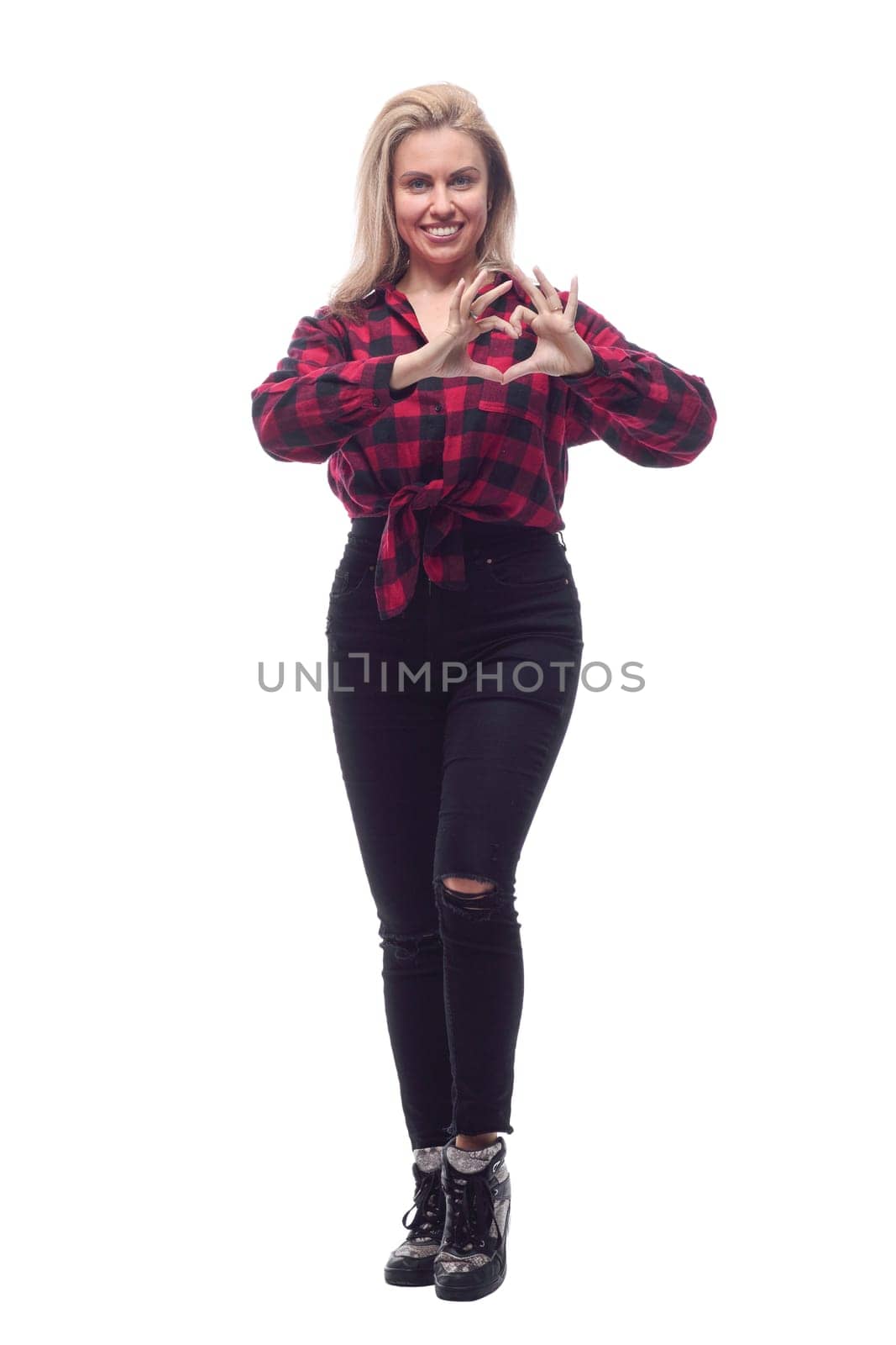 full-length.casual young woman in a red checked shirt and tight pants. isolated on a white background.